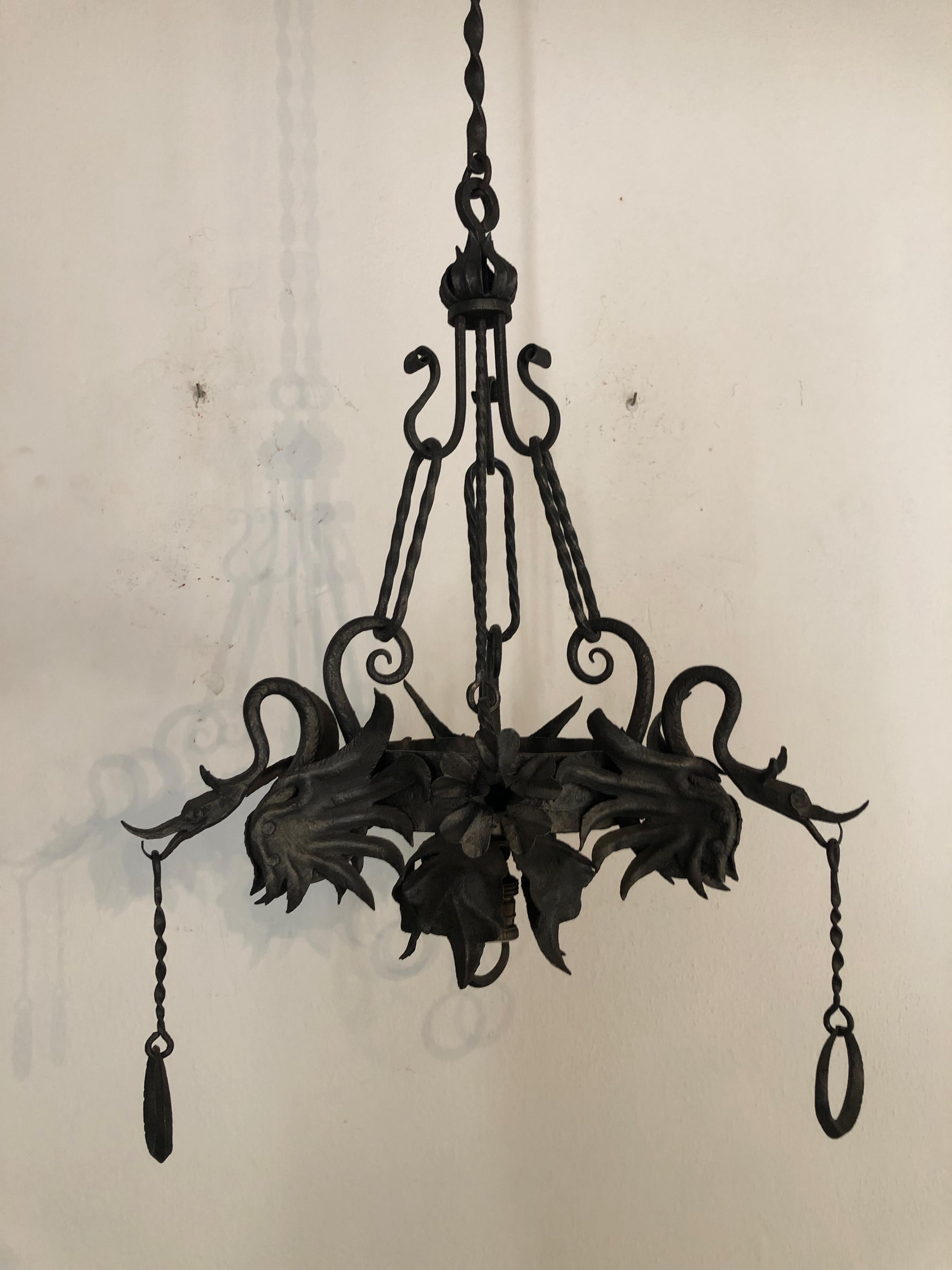 Housing one-light. Will be rewired with certified US UL sockets for USA and appropriate sockets for all other countries and ready to hang. Detachable chains. Detailed dragons and flowers. Huge canopy still intact. Wrought iron has been treated to