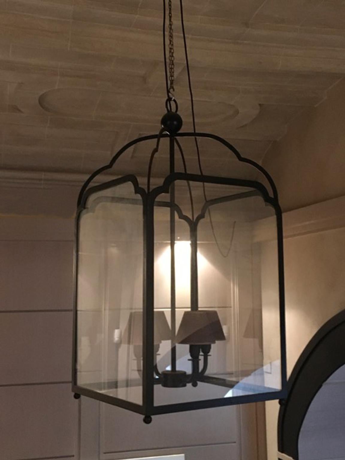This is a charming lantern  that was made in Italy in iron. The finish is in lacquer mat black.  Its dimensions are consistent and it can match perfectly for an important entry hall in your home or villa, in hotels and also in restaurants. 
The