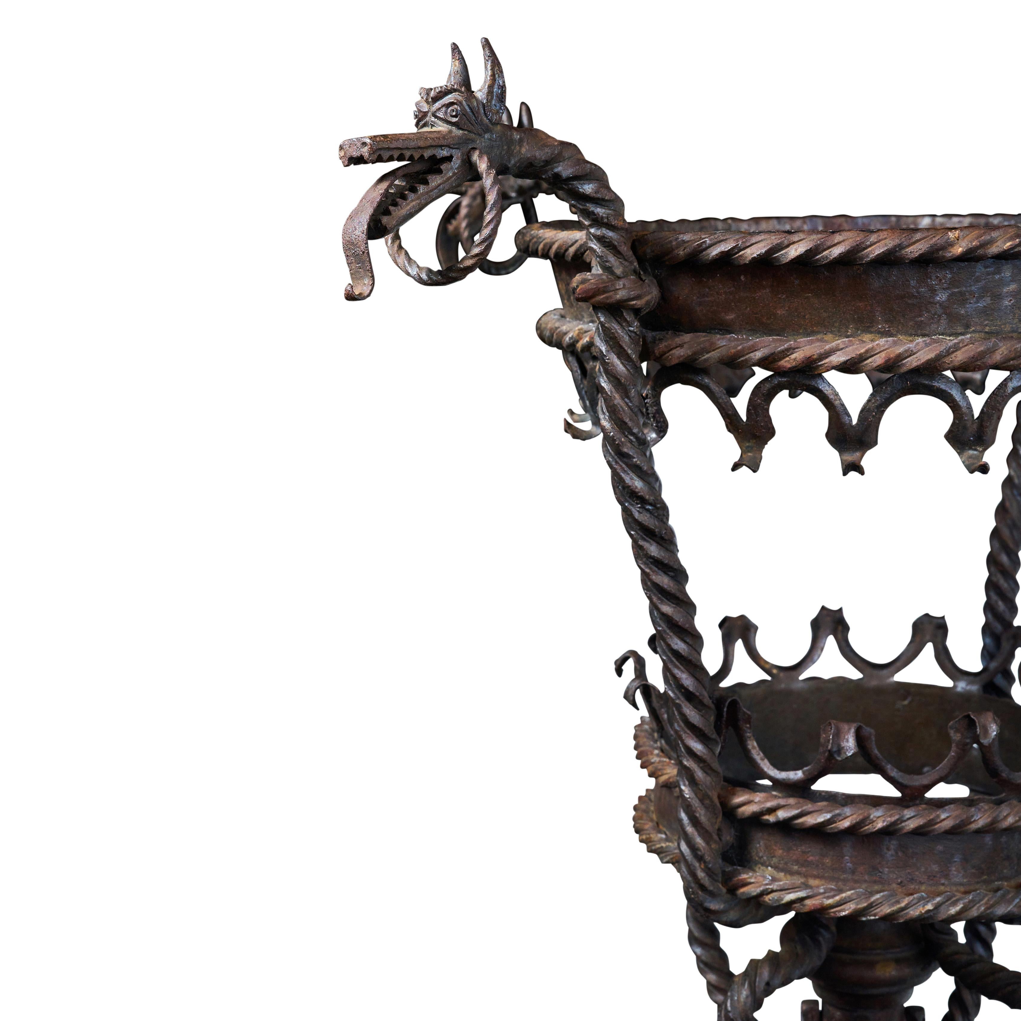 Early 20th Century Italian Wrought Iron Planter with Decorative Beastie Heads For Sale