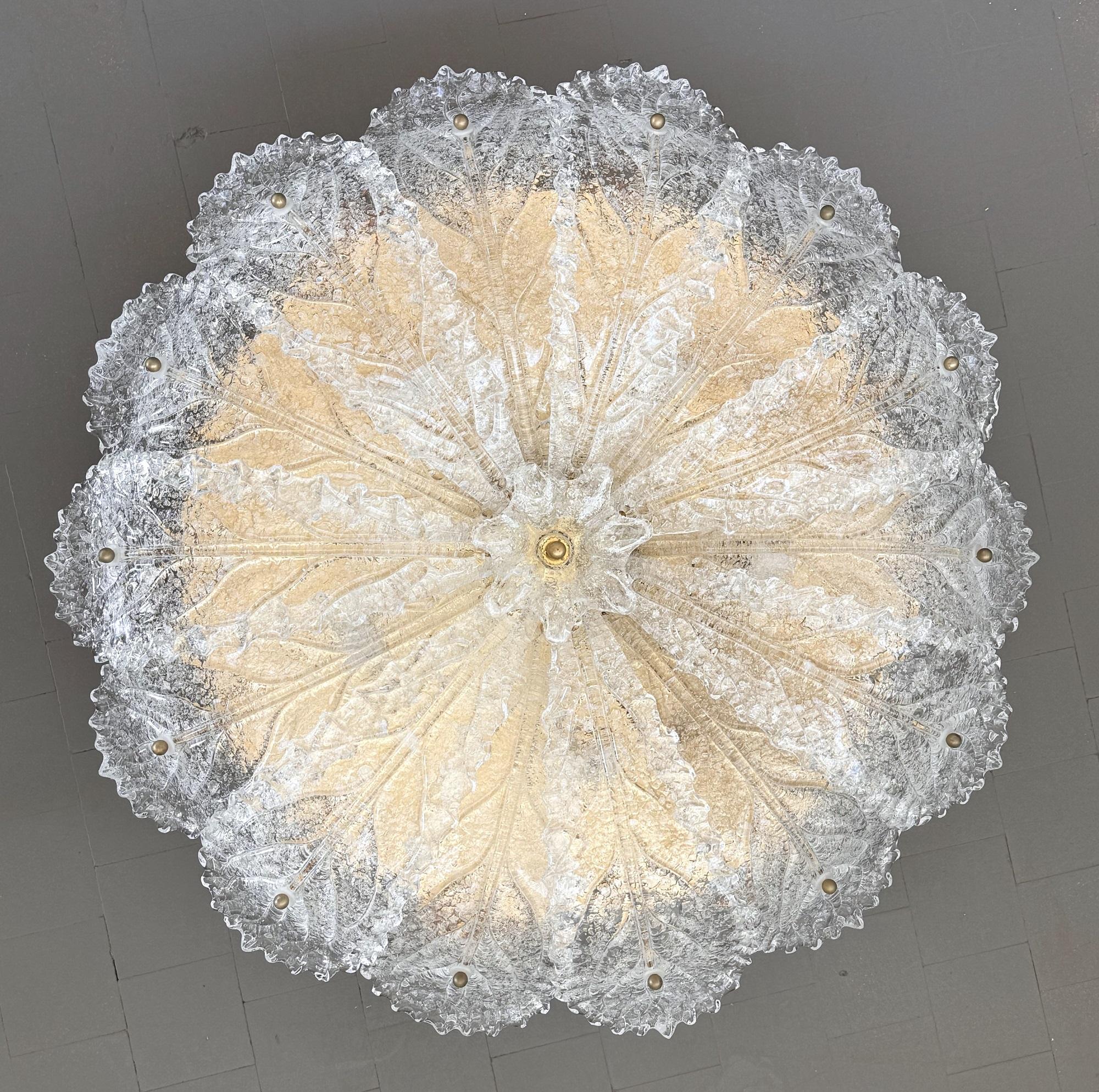 Italian XL Mid-century Flush Mount Chandelier with Grit Murano Glass, 1970s

Grit Murano Glass Flush Mount in transparent color with brass details, Made in Italy 1970s.
The flush mount is made of 14 big glass leaves with typical leaves pattern,