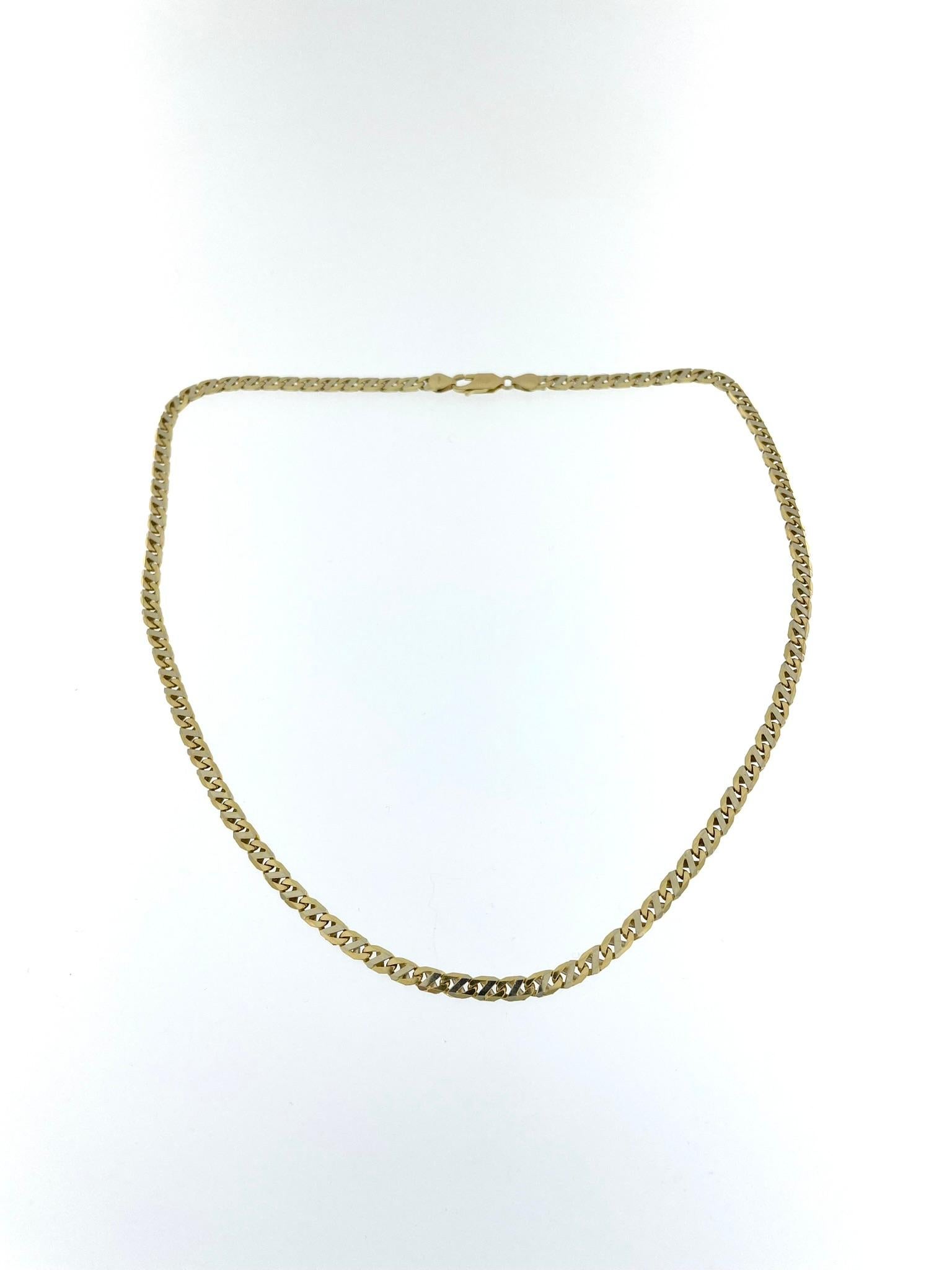 The Italian Yellow and White Gold Chain Necklace is an exquisite piece of jewelry crafted with precision and elegance. This necklace is made from 18-karat gold, showcasing a stunning combination of yellow and white gold. The use of both colors adds