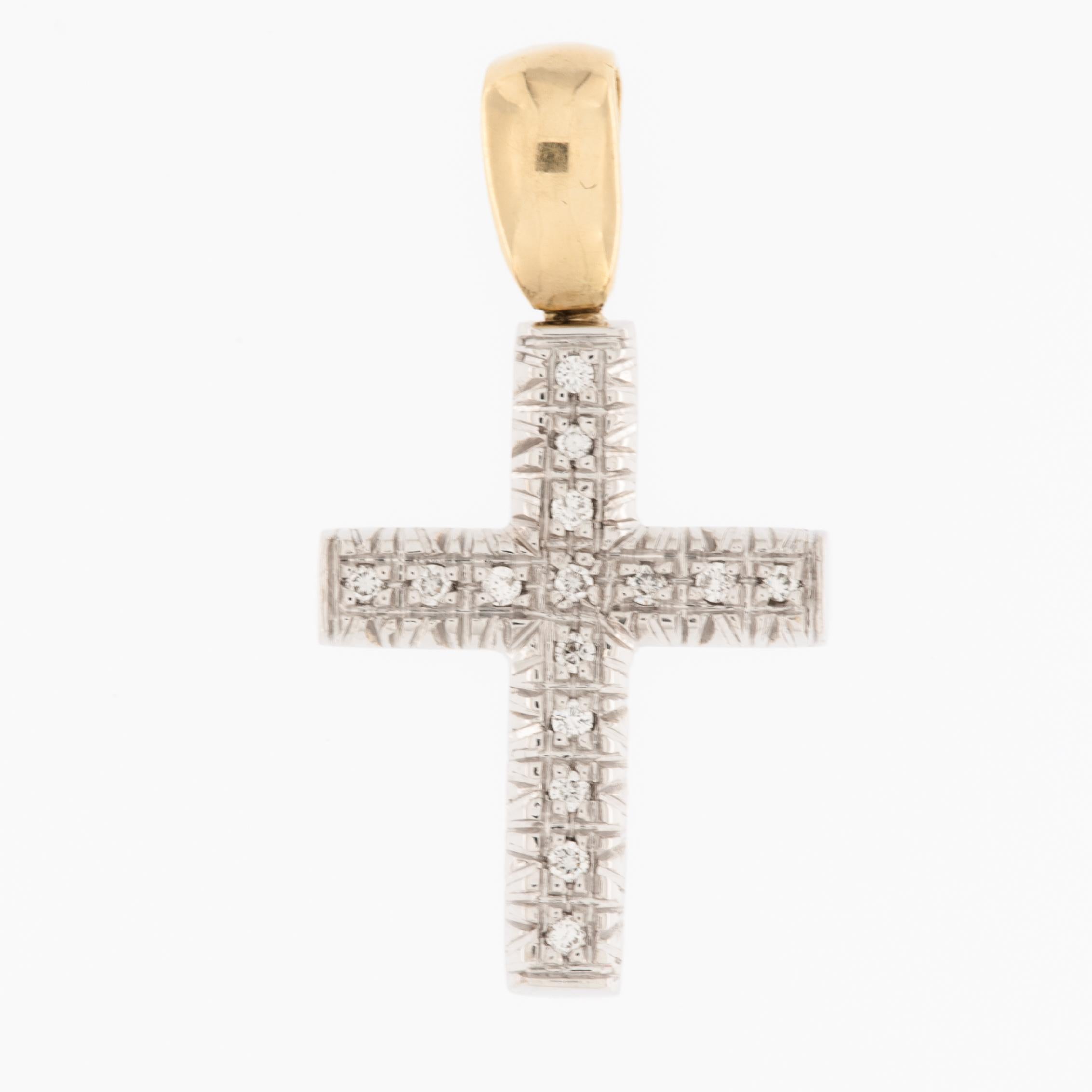 The Italian Yellow and White Gold Cross with Diamonds featuring relief work is a stunning piece of jewelry that combines traditional craftsmanship with the elegance of precious metals and sparkling gemstones. 

The cross is crafted from a