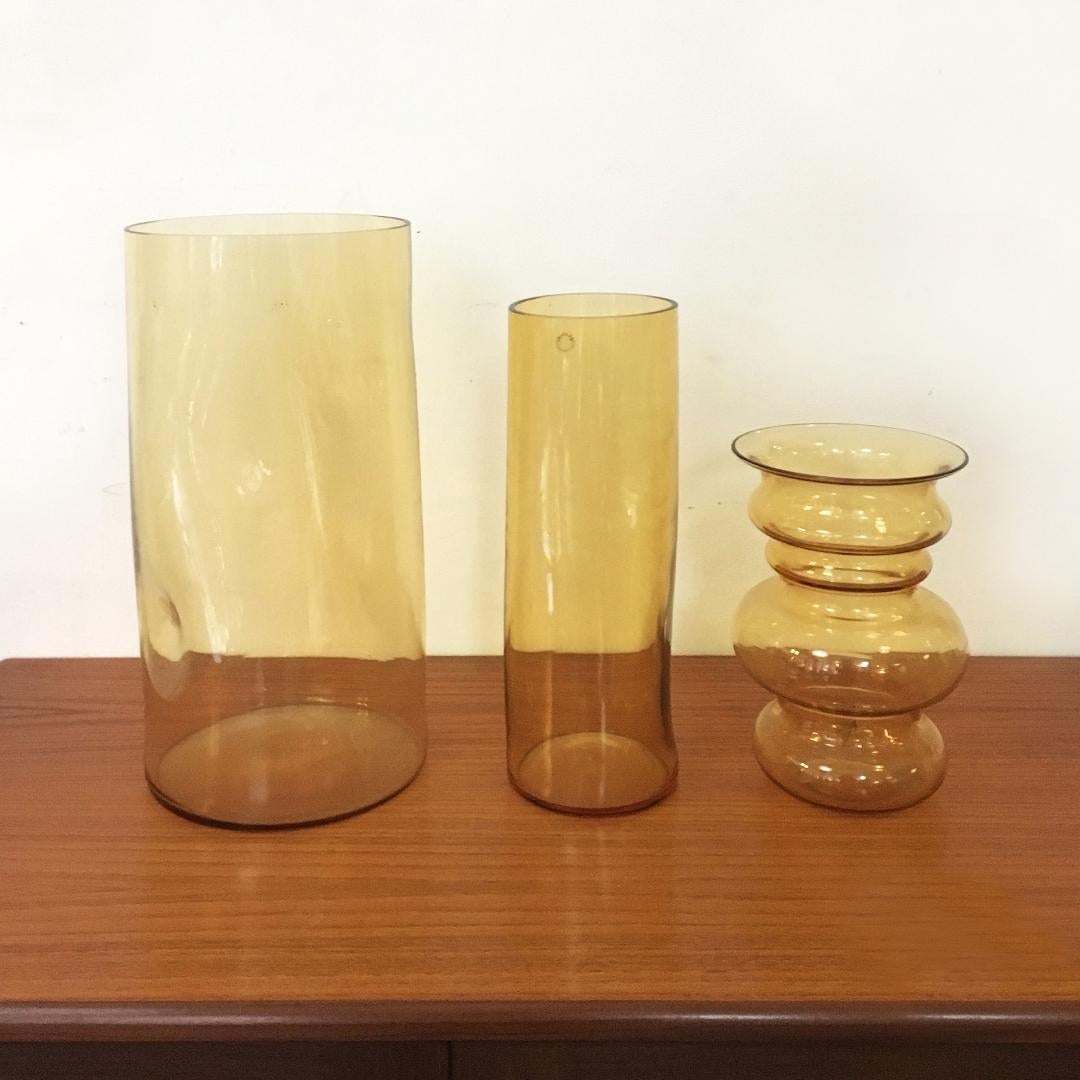 Three Italian yellow blown Murano glass vases by Carlo Nason in the 1960s and 1970s
Set of three blown Murano glass vases, with three different shapes and sizes.
Designed by Carlo Nason in the 1960s and 1970s, with brand.
Large size 19.5 x 41 H