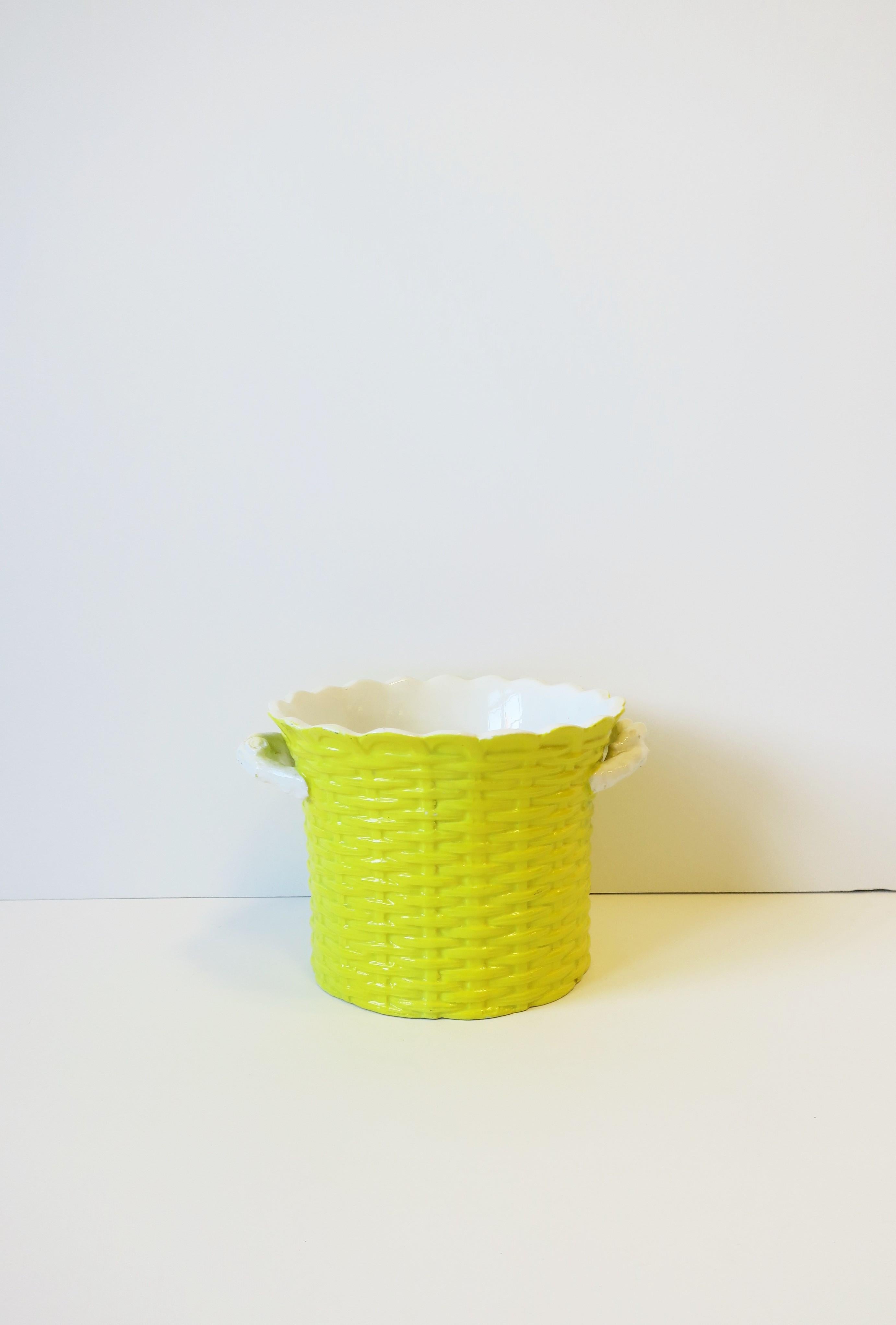 An Italian bright yellow and white ceramic 'wicker' ice bucket/wine cooler or cachepot/plant/flower pot holder, circa 1960s, Italy. Piece has a scalloped top edge, yellow wicker weaved design, and 'branch' handles. Piece is an ice bucket or wine