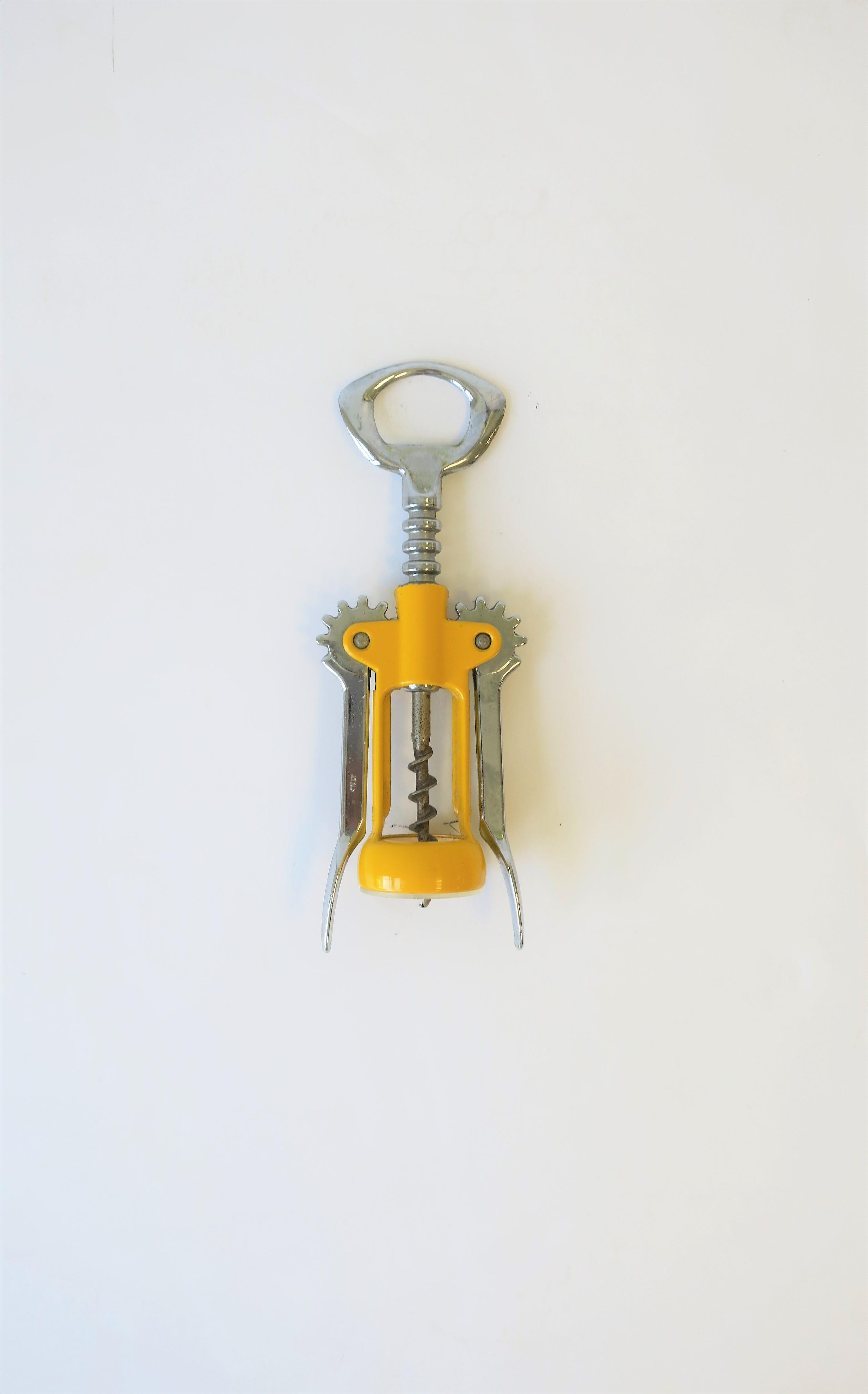 An Italian yellow enamel and chrome metal corkscrew wine bottle opener, circa late-20th century, Italy. Marked 