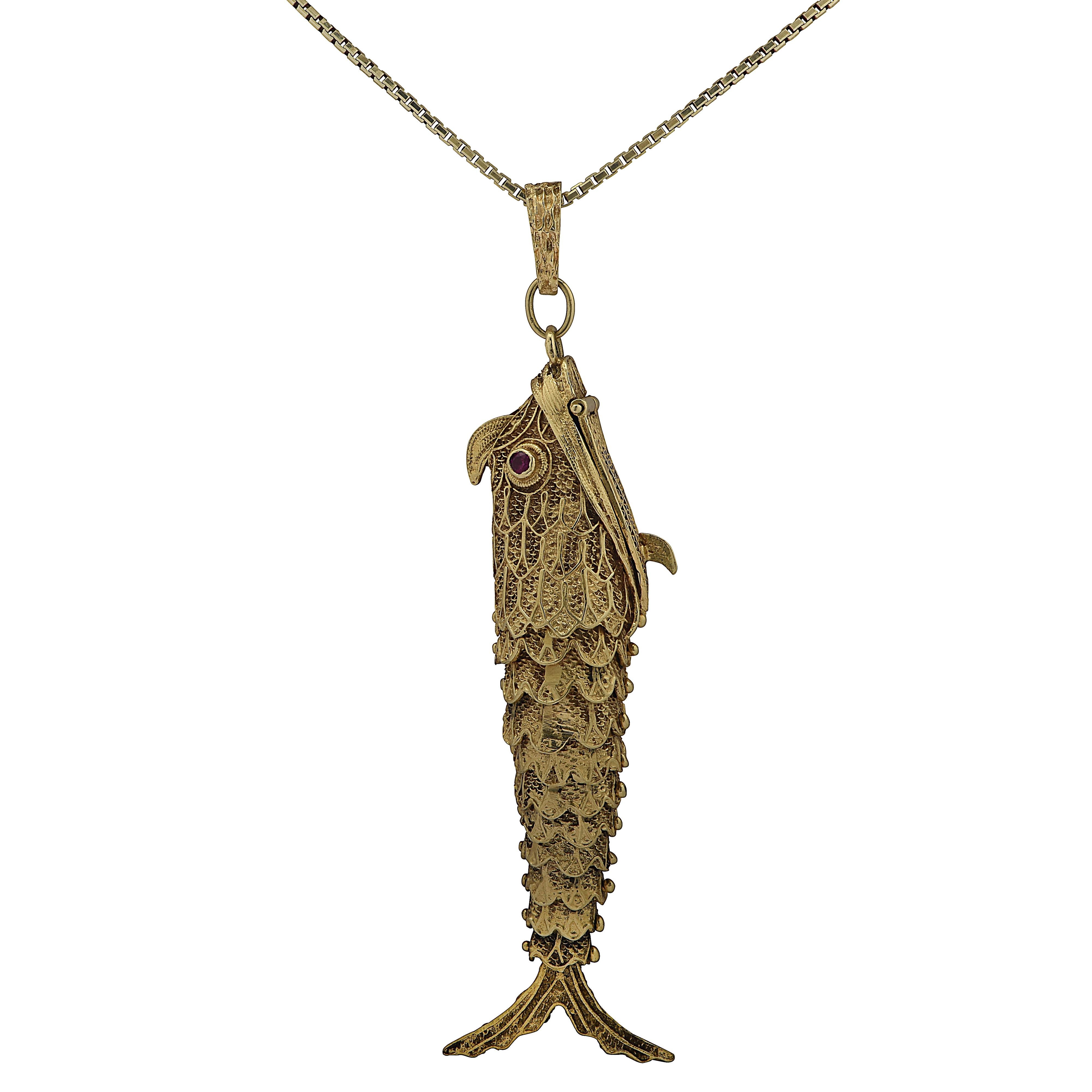 gold fish pendant meaning