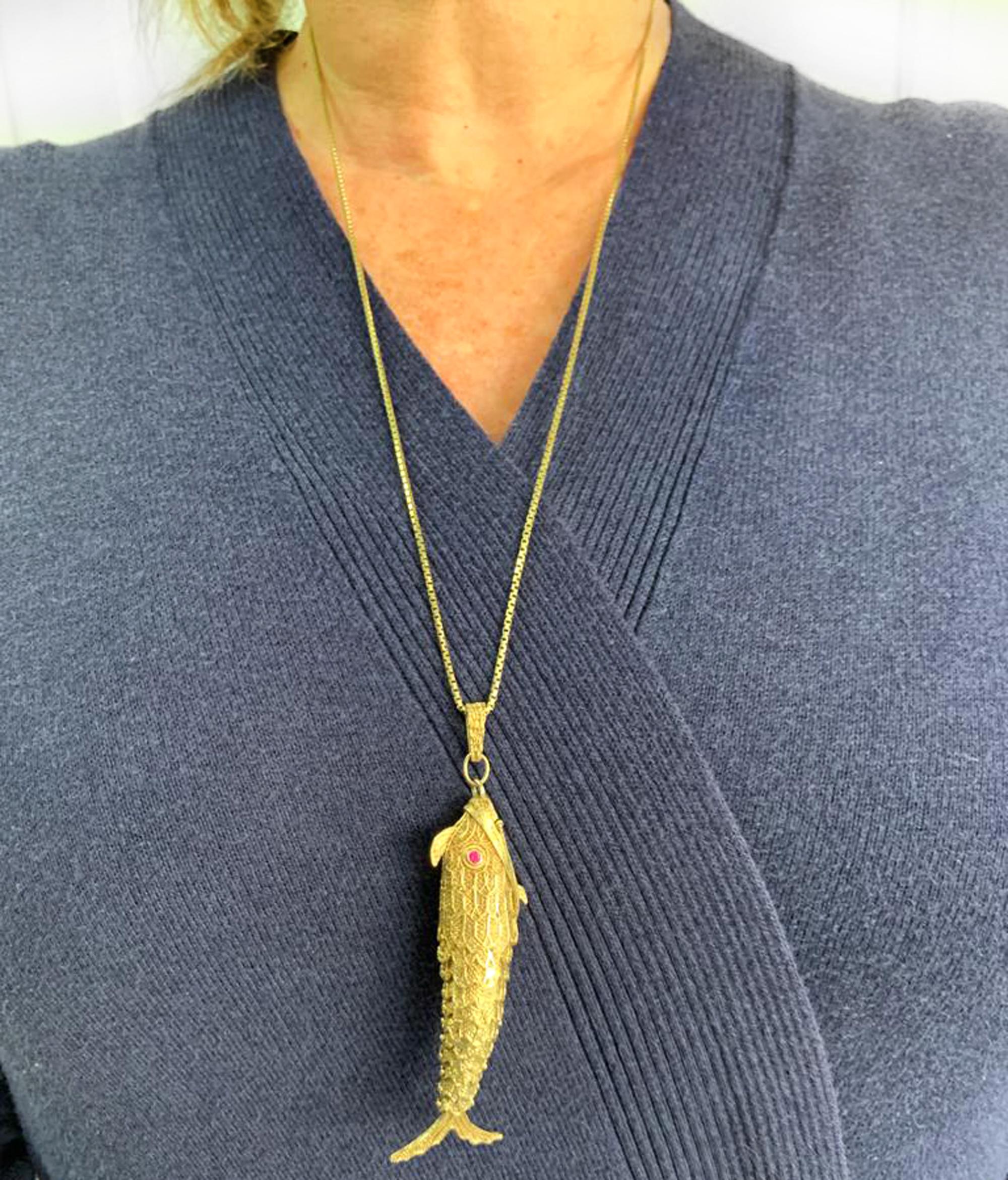 fish pendant gold meaning