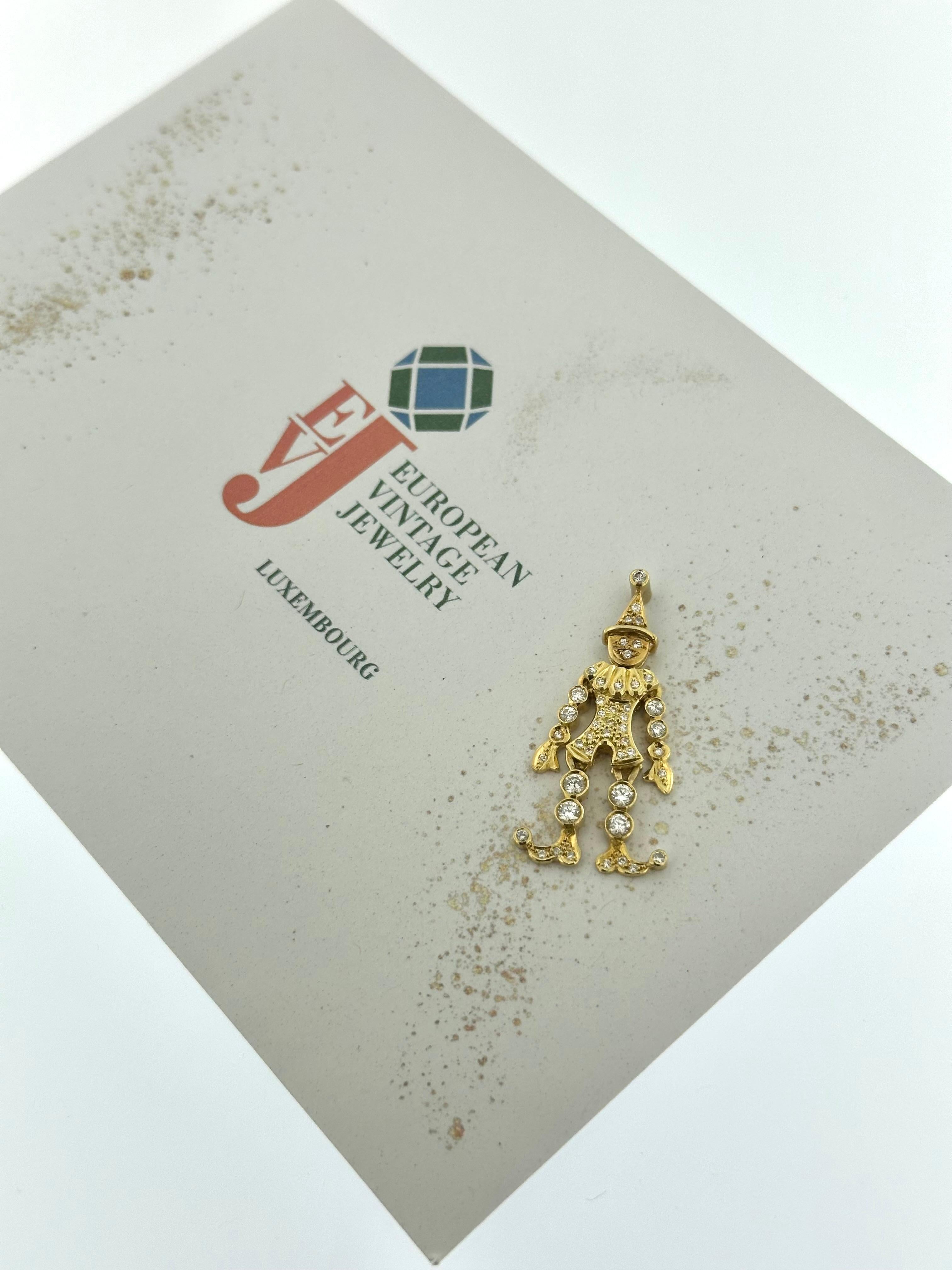 This Italian Yellow Gold Harlequin Flexible Pendant is a whimsical and luxurious piece, showcasing the playful charm of Italian craftsmanship. Made from 18kt yellow gold, the pendant features a unique, flexible design inspired by the dynamic and