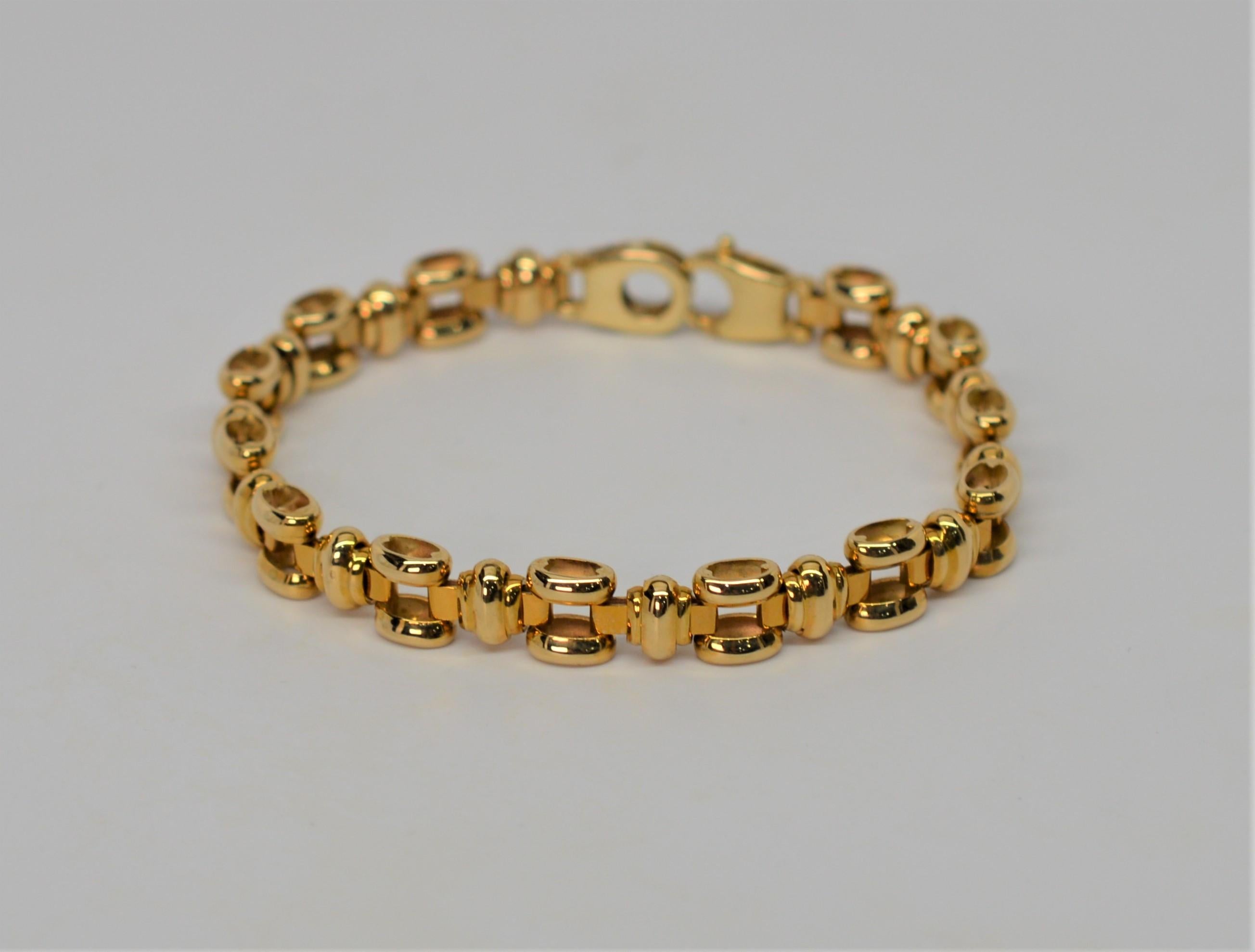 Finely crafted Italian 14 Karat Yellow Gold Link Bracelet with high quality lobster clasp. Interesting dimensional tubular square links enhanced with stylist solid gold hinged connectors. Bright attractive, highly polished finish. The bracelet