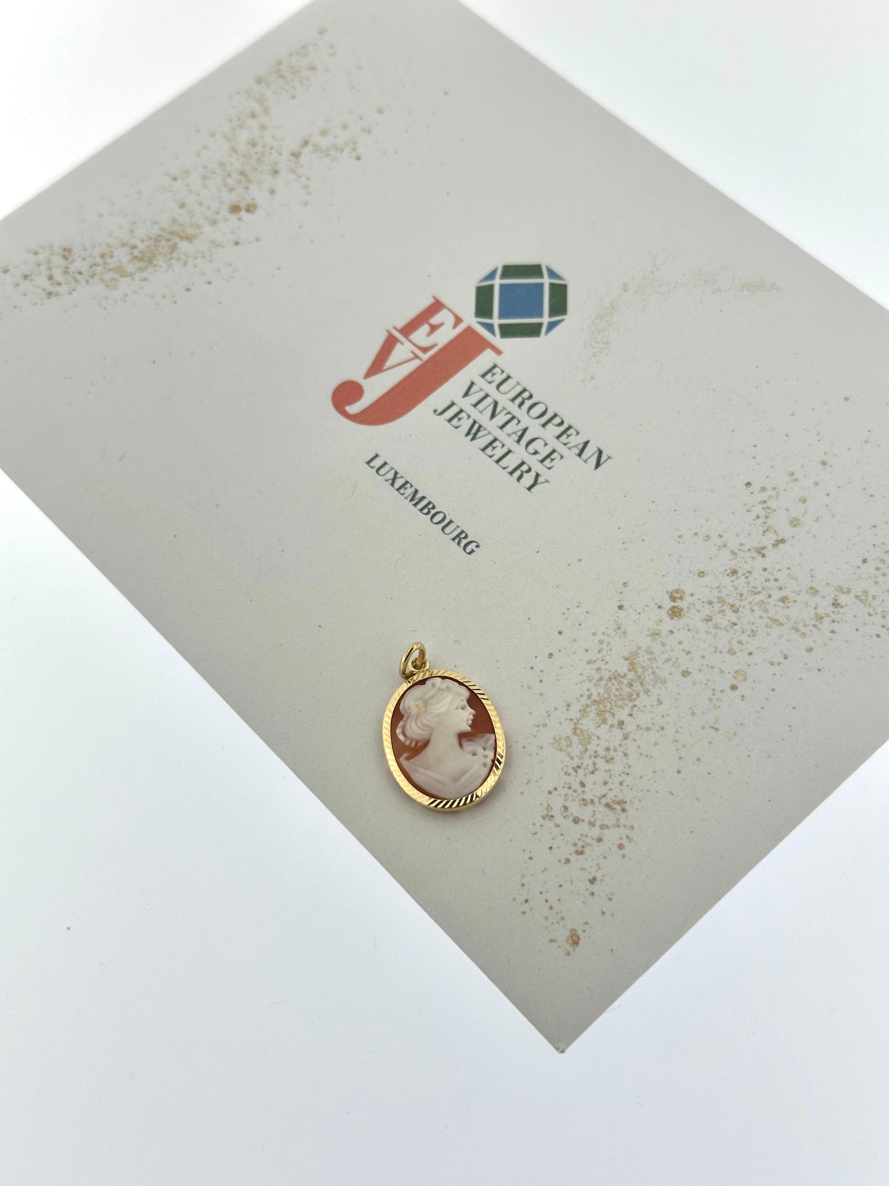 This Italian Yellow Gold Pendant with Cameo  is a timeless piece of jewelry, embodying the rich tradition of Italian craftsmanship, particularly from the renowned region of Torre del Greco near Napoli, famous for its exquisite cameos. Crafted from