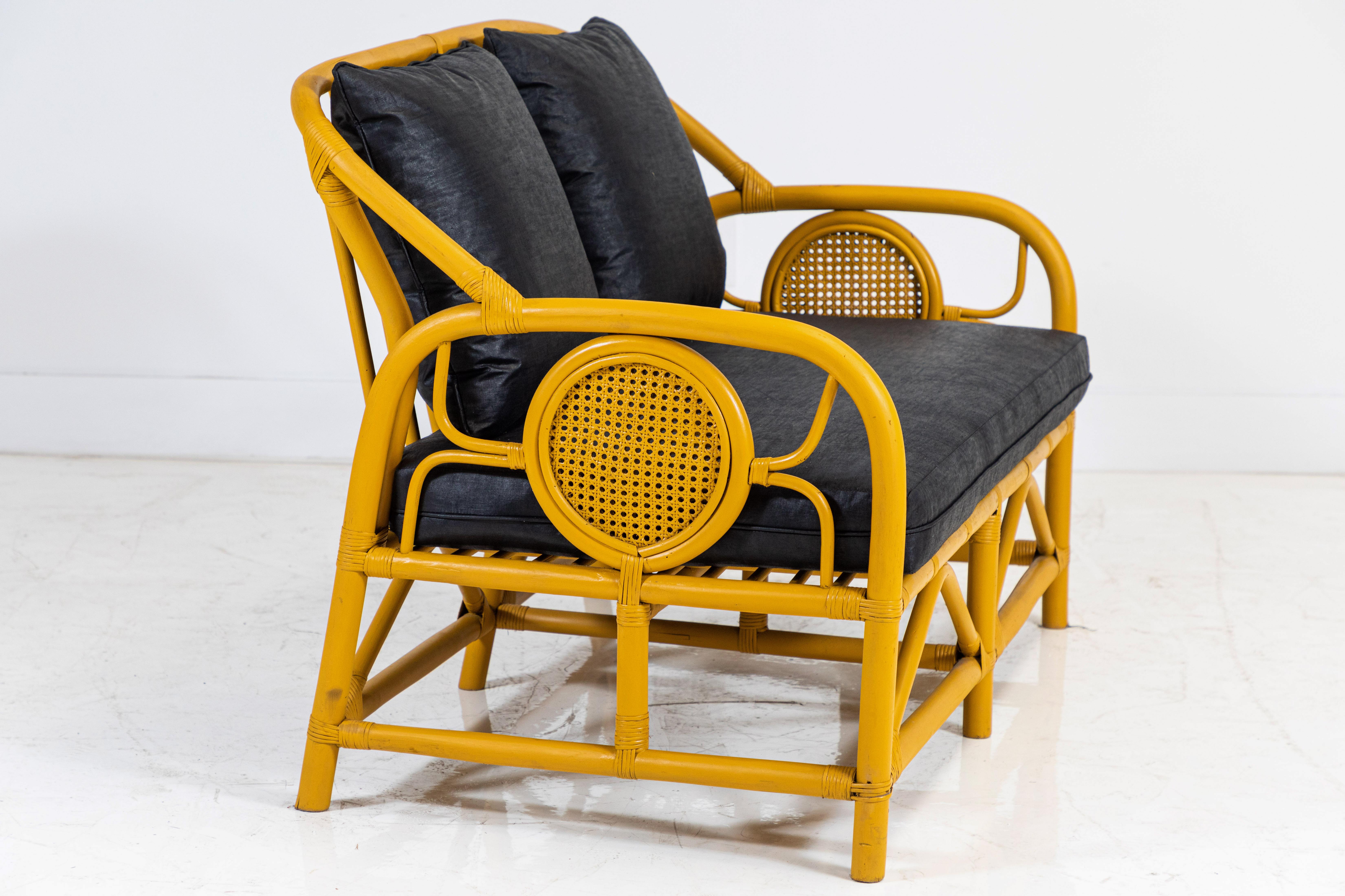 Italian yellow painted bamboo settee and pair of chairs upholstered in black beetled Linen from UK textile company Howe. Settee measures: 51.5