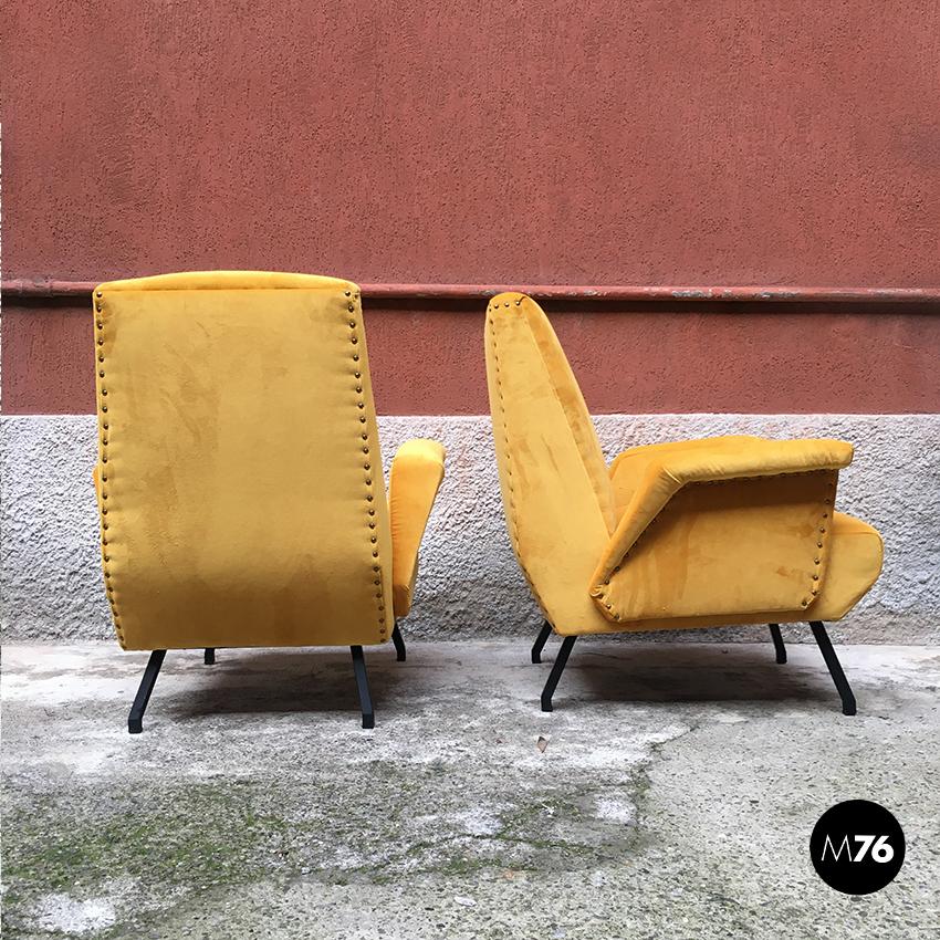 Italian yellow velvet armchairs, 1960s
Armchairs with armrests covered in fire yellow velvet with square section metal legs, finished on the profile with brass studs
Completely restored and re-upholstered.