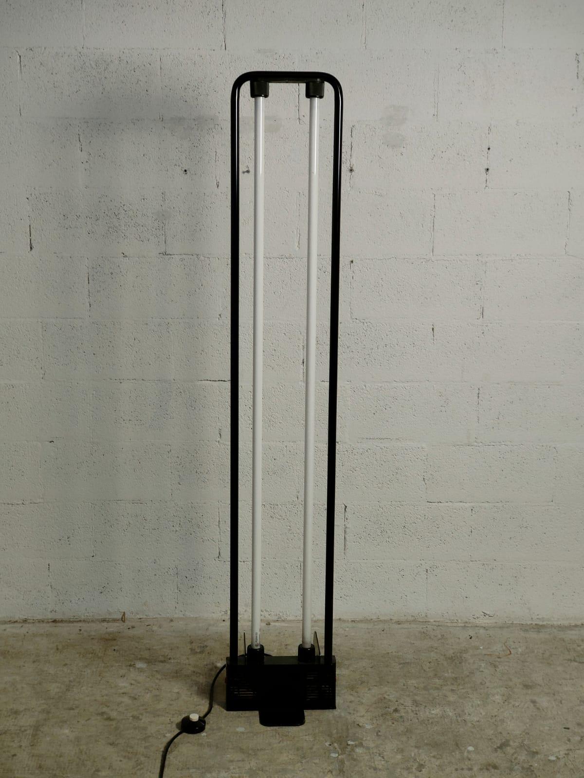 Modern floor lamp design by Gian Nicola Gigante, Marilena Boccato and Antonio Zambusi in 1981 for Zerbetto. 
Black lacquered metal structure with double neon, black metal base.
These lights are simplistic and geometric in their design and feature