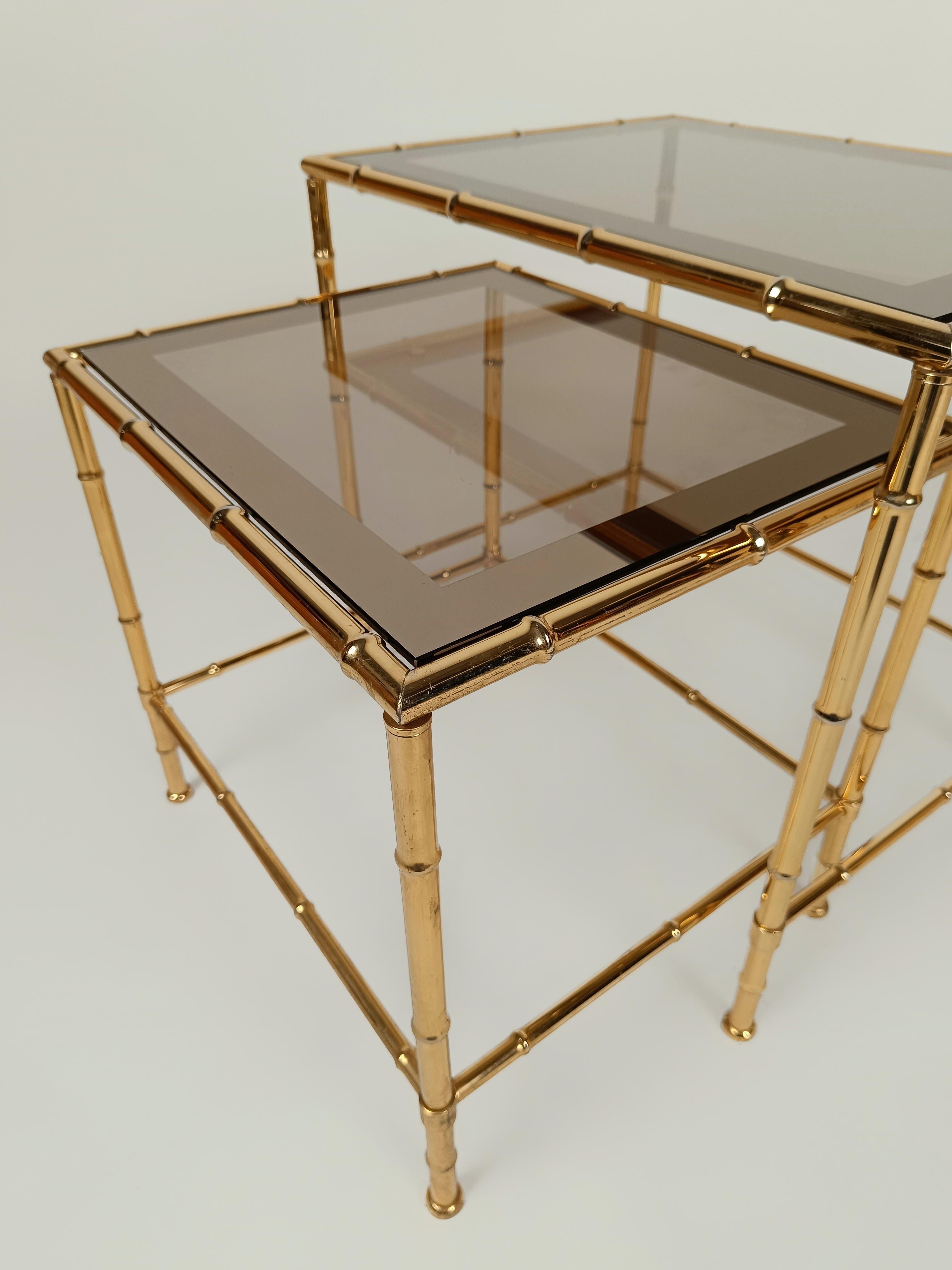 A beautiful set of 2 vintage brass faux bamboo nest of tables.
This stunning mid-modern century piece is probably made in Italy between the 1970s and the 1980s, in the style of the renowned and eminent design house of ‘Maisen Bagues’.
The brass