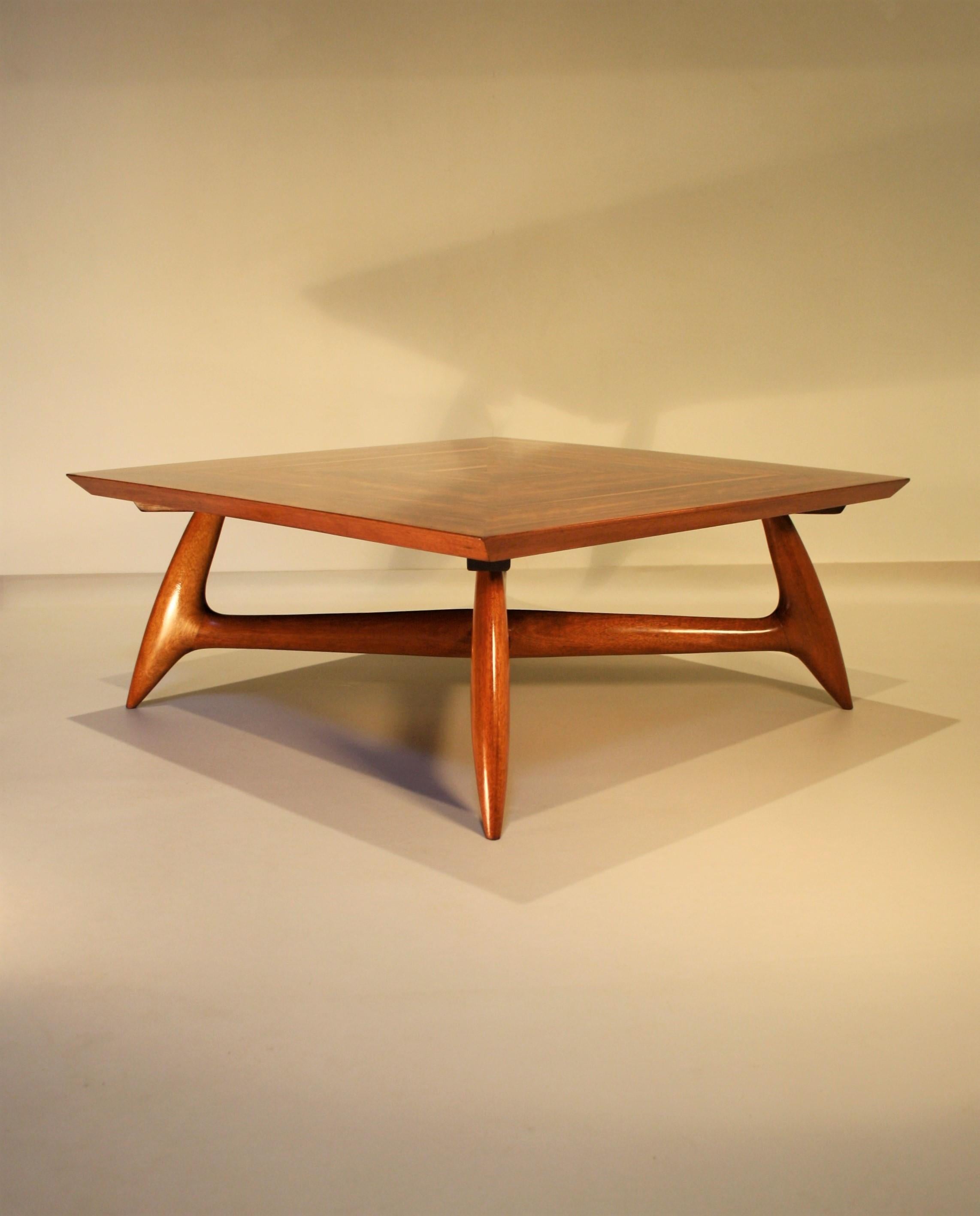 Rare coffee table by Pierluigi Giordani made from walnut, circa 1955.
The square table top has a beautiful veneered walnut inlay of four parts and the biomorphic shaped base is made of solid walnut.
The whole is in very good condition and on photo 8