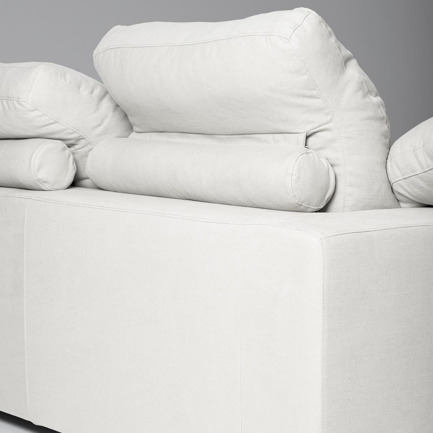 This bright, contemporary white fabric sofa from the Tribeca collection will add light and elegance to any home space. A three-seat sofa with plush seat cushions in polyurethane foam and goose down, square armrests, and three backrest cushions, this