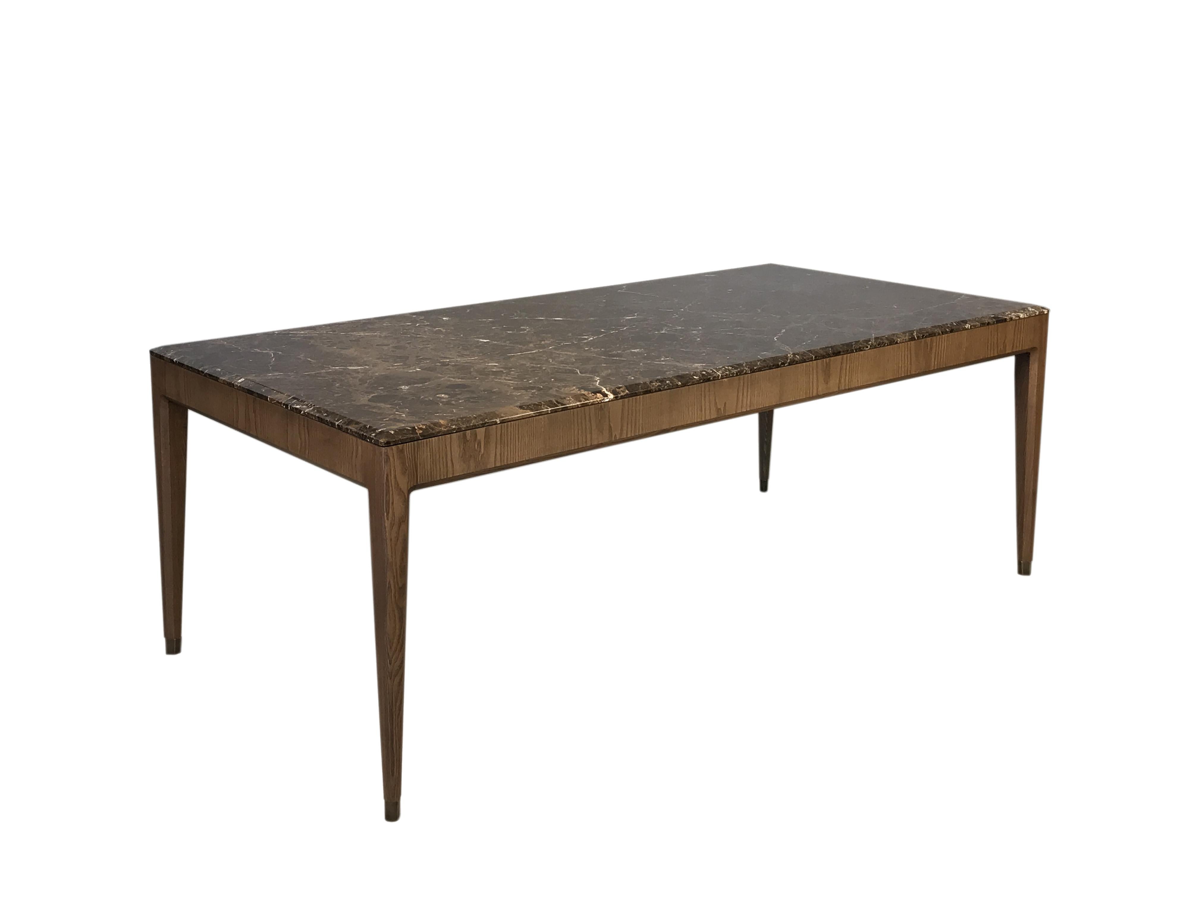 Contemporary dining table made of ashwood with marble top and brass tips.
custom made to order
 