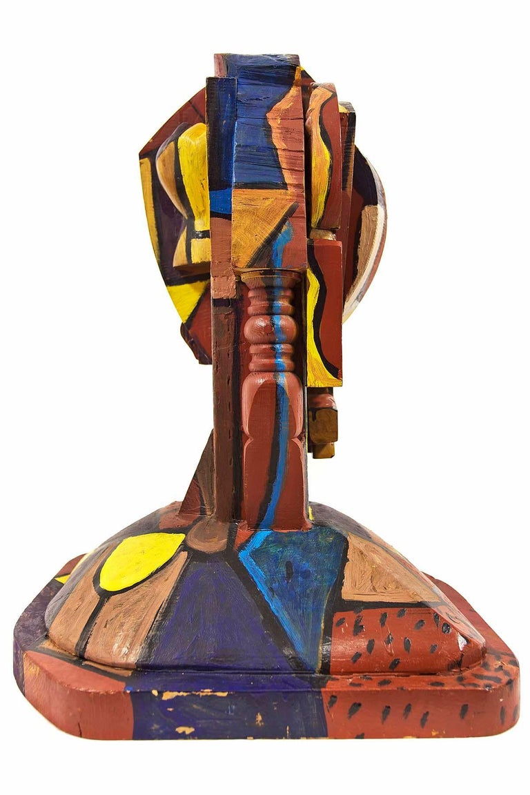 This painted wood assemblage sculpture by Italo Scanga, epitomizes the characteristics of his oeuvre. Polychrome head portrait bust.
This was signed on a brass or bronze plaque but that has gone missing. It is unsigned. I believe there might be a