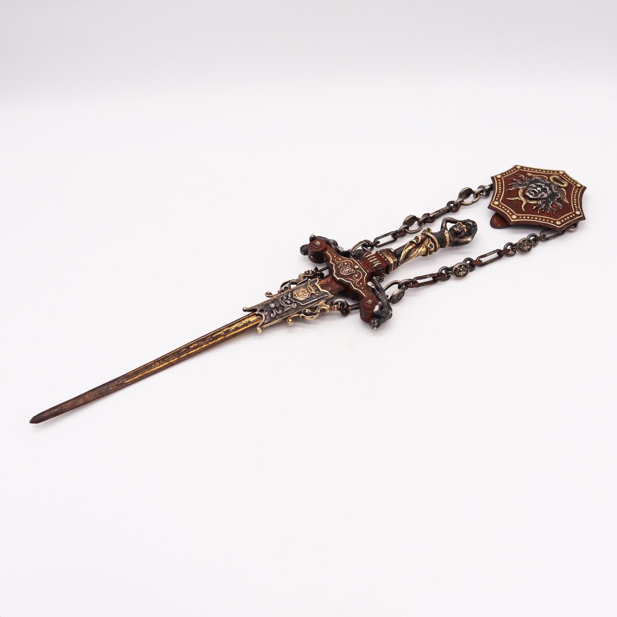 A 19th century Stiletto Dagger made in Florence

An exceptional antique early 19th century Italian Florentine stiletto dagger with a beautifully and extremely well forged details. Made up in iron, .800 silver and .750 gold with accents in gold