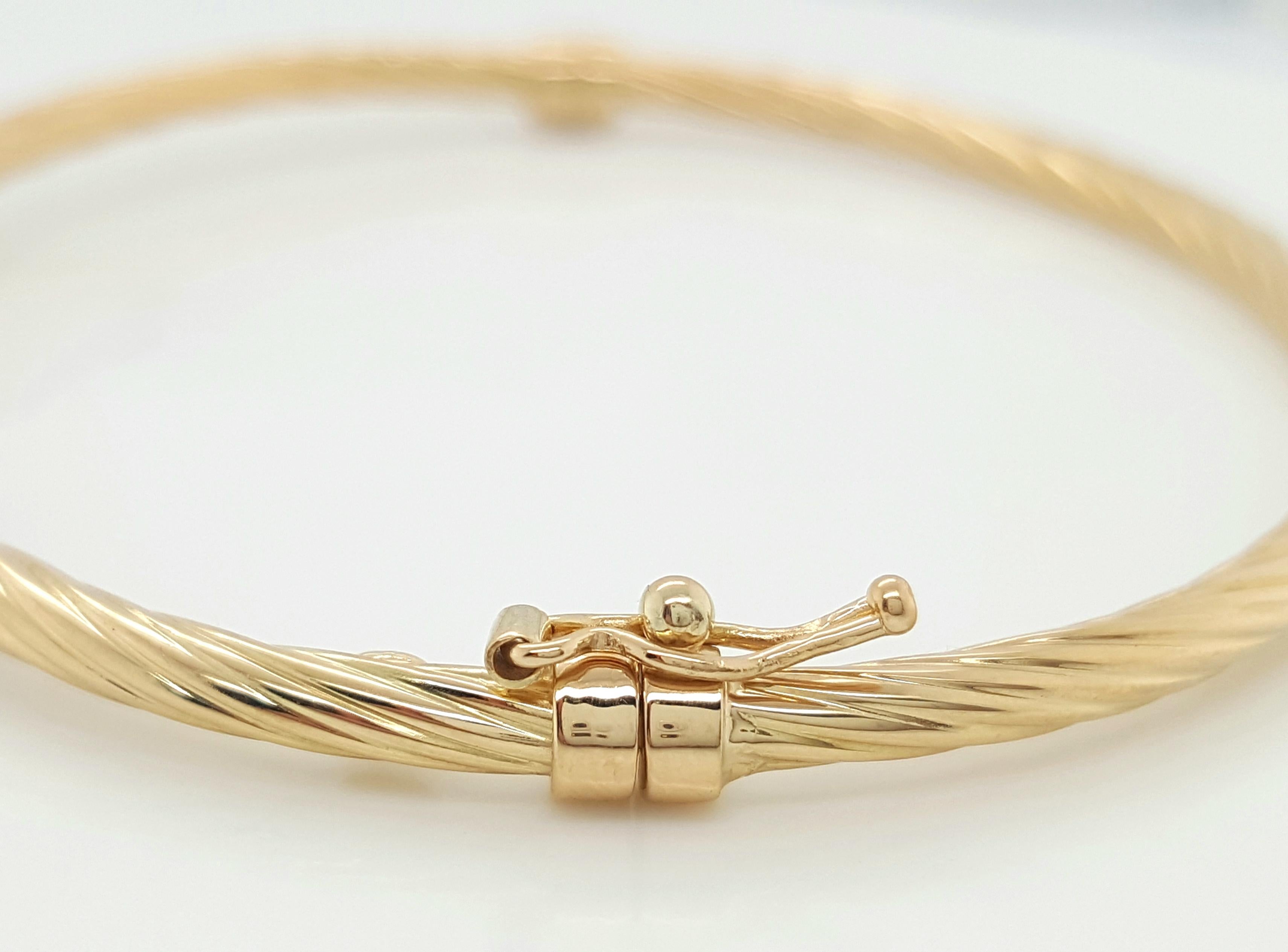 This bracelet is sure you make feel like a golden goddess. It’s made perfectly to lay flat on the wrist. It is 18 karat yellow gold weighing 4.1 grams. It is 2.9 mm wide. The closure is tongue and grove with a safety latch on one side for extra