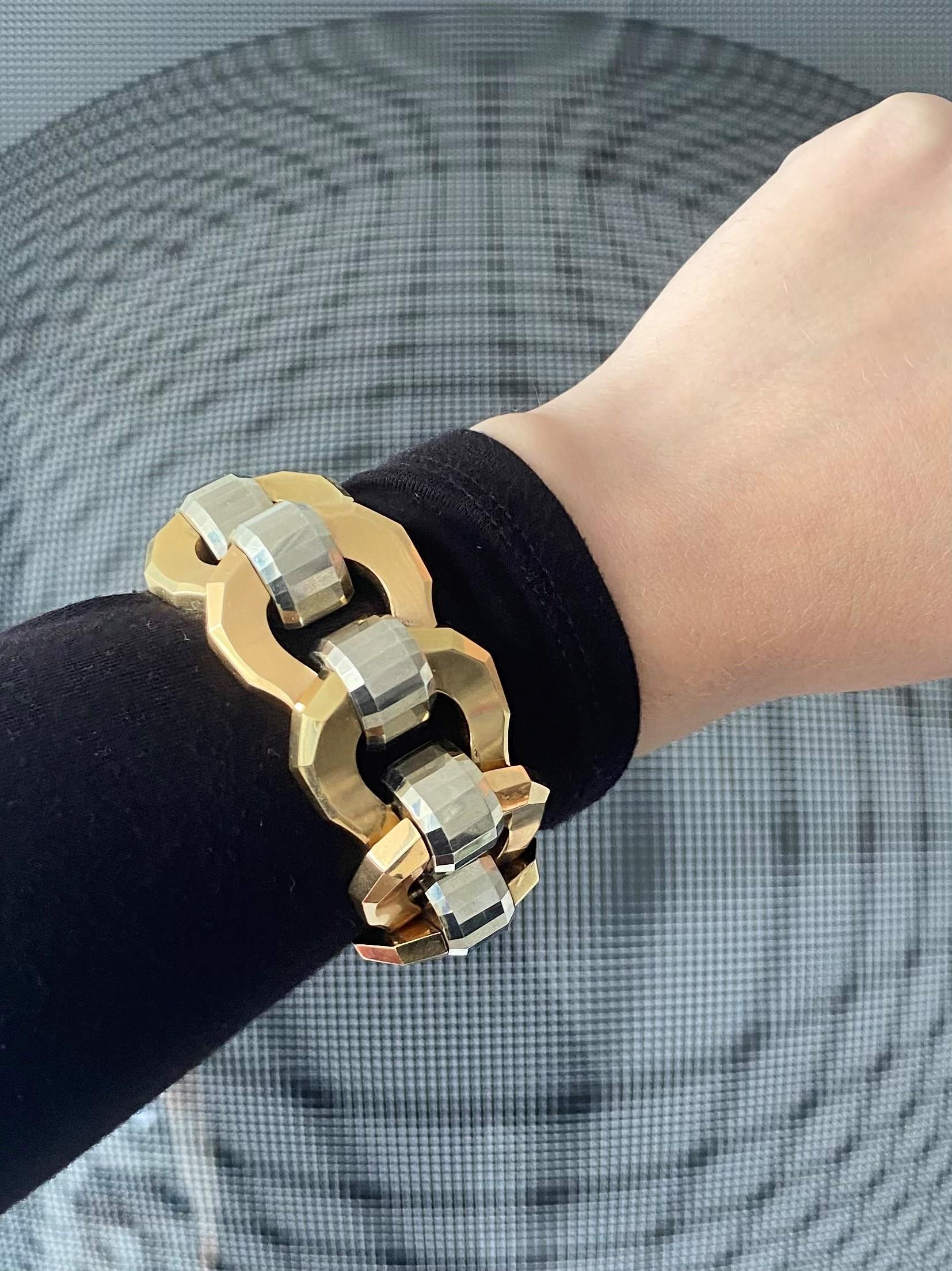 Italian art deco faceted tank bracelet.

Description: Beautiful bold piece, created in Italy during the art deco period, back in the 1930's. This tank bracelet has been crafted with faceted patterns in solid yellow and white gold of 18 karats with