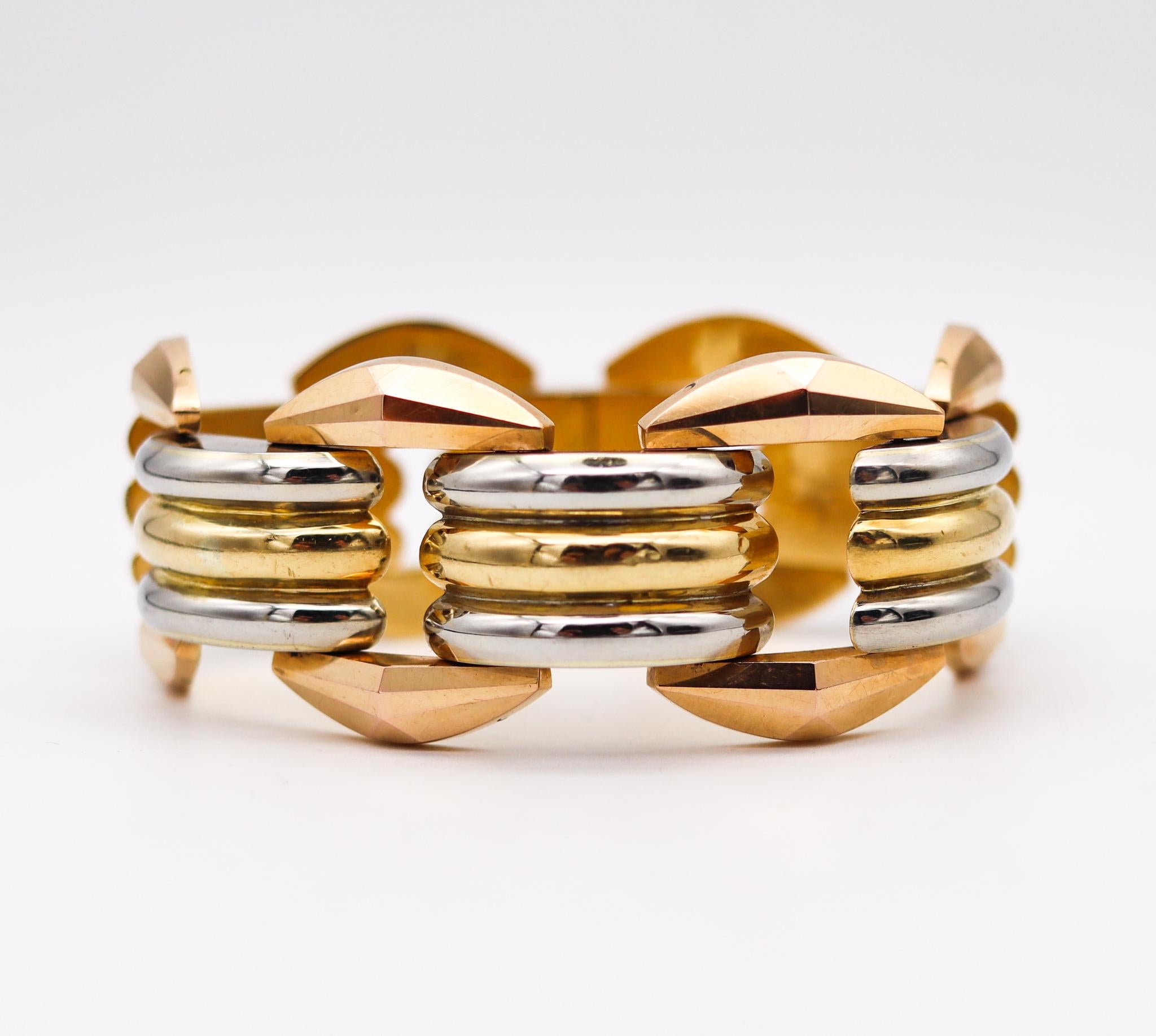Italian art deco faceted tank bracelet.

Beautiful bold piece, created in Milano Italy during the transition of the art deco and retro periods, back in the 1935. This tank bracelet has been crafted with faceted patterns in solid 18 karats gold of