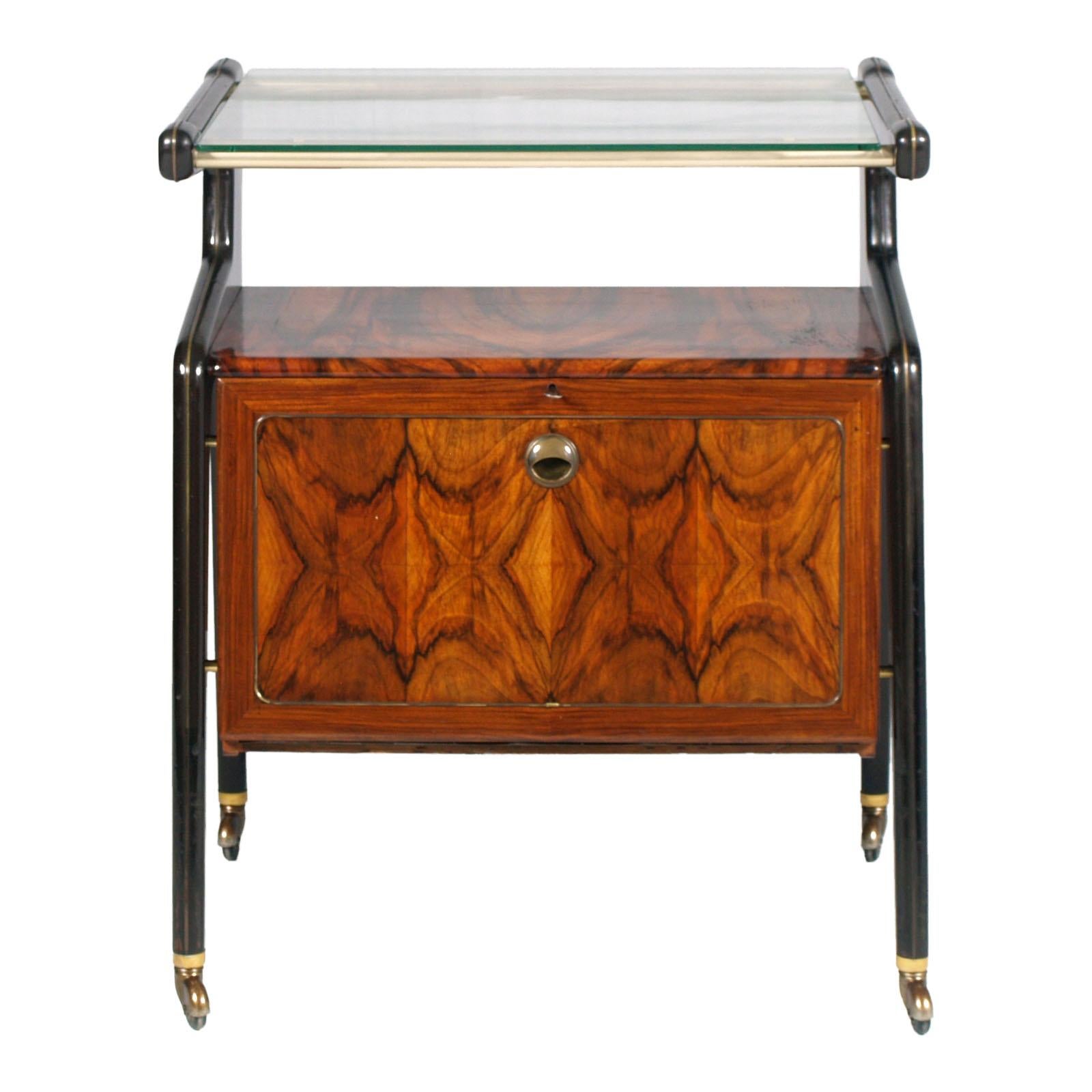 A Brugnoli Mobili Cantù  Dry Bar Cart, laquered walnut in mahogany color, brass thread & burl walnut veneered; cristal top . Lighted interior compartment with a washable plastic-coated finish in excellent condition. Brass movement and closing