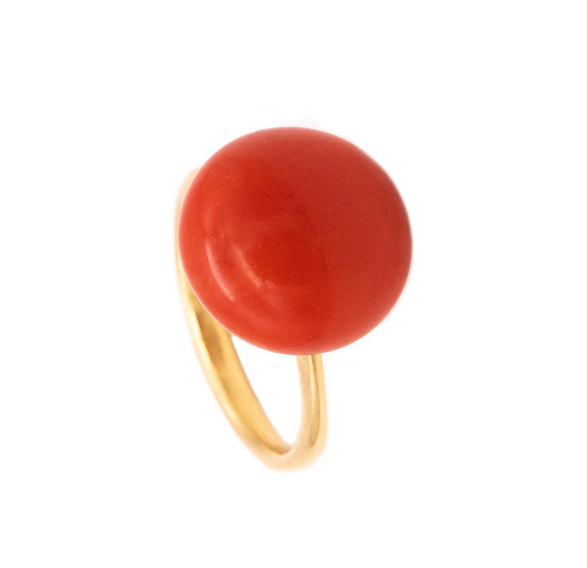 Solitaire cocktail ring with Sardinian Red Coral.

A vintage Italian ring from the mid-century period, circa 1950's. The mounting is crafted in solid 18 karats yellow gold and embellished on top, with a single round cabochon cut (14.5 x 9 mm) of a