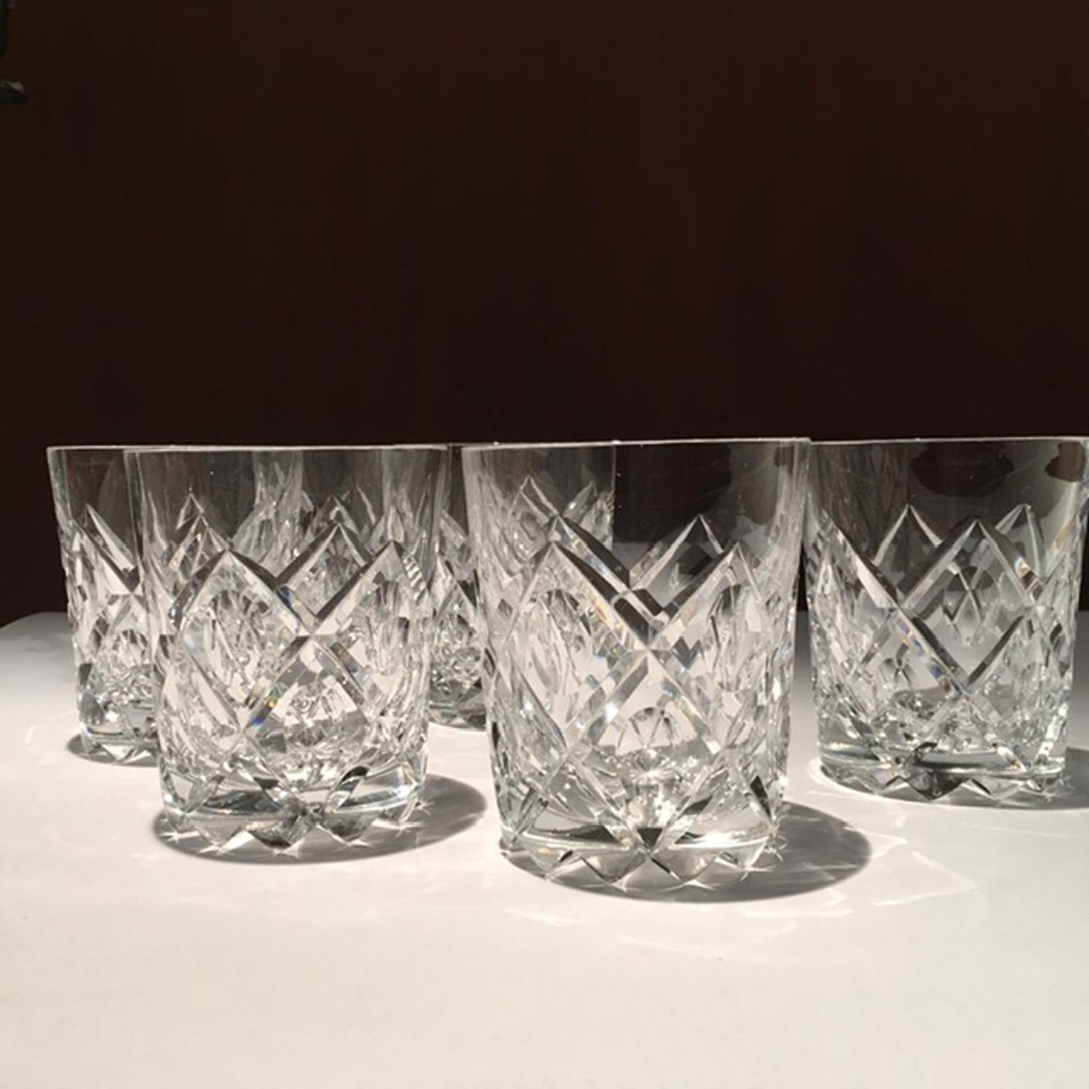 Glamourous set of 6 crystal whiskey glasses. It is a pleasure to have this glass in hand.
Their engravings are deep and the drawing is fashinating. 
They look coming out from a James Bond film.

With certificate of authenticity.