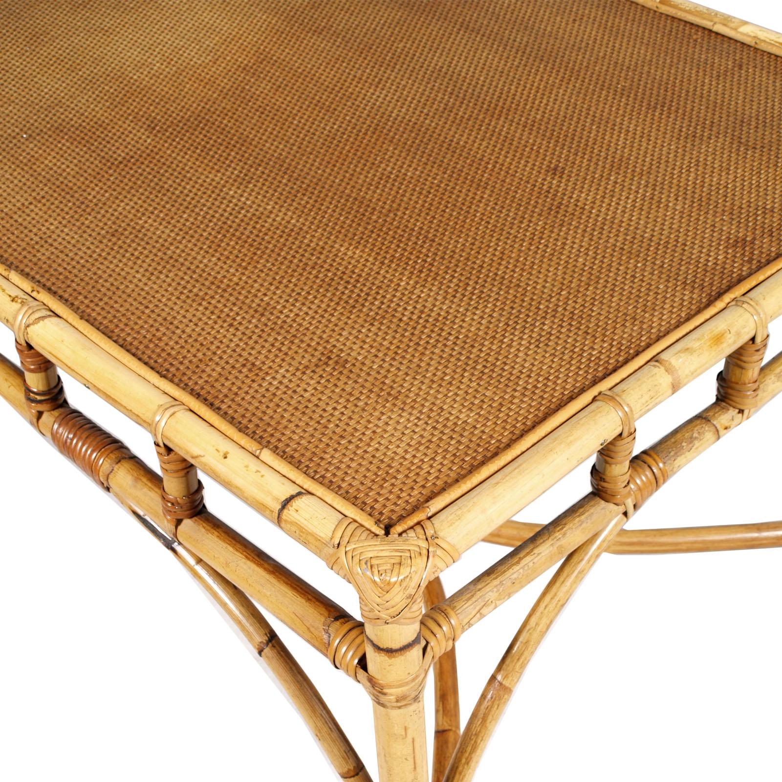 Italian mid-century rattan and bamboo dining table by Franca Helg for Dal Vera, circa 1960.
Smoked glass table top.  Measures cm: table H 75, W 140, D 80

Very good condition, it show little signs of use and age.
This elegant table will be perfect