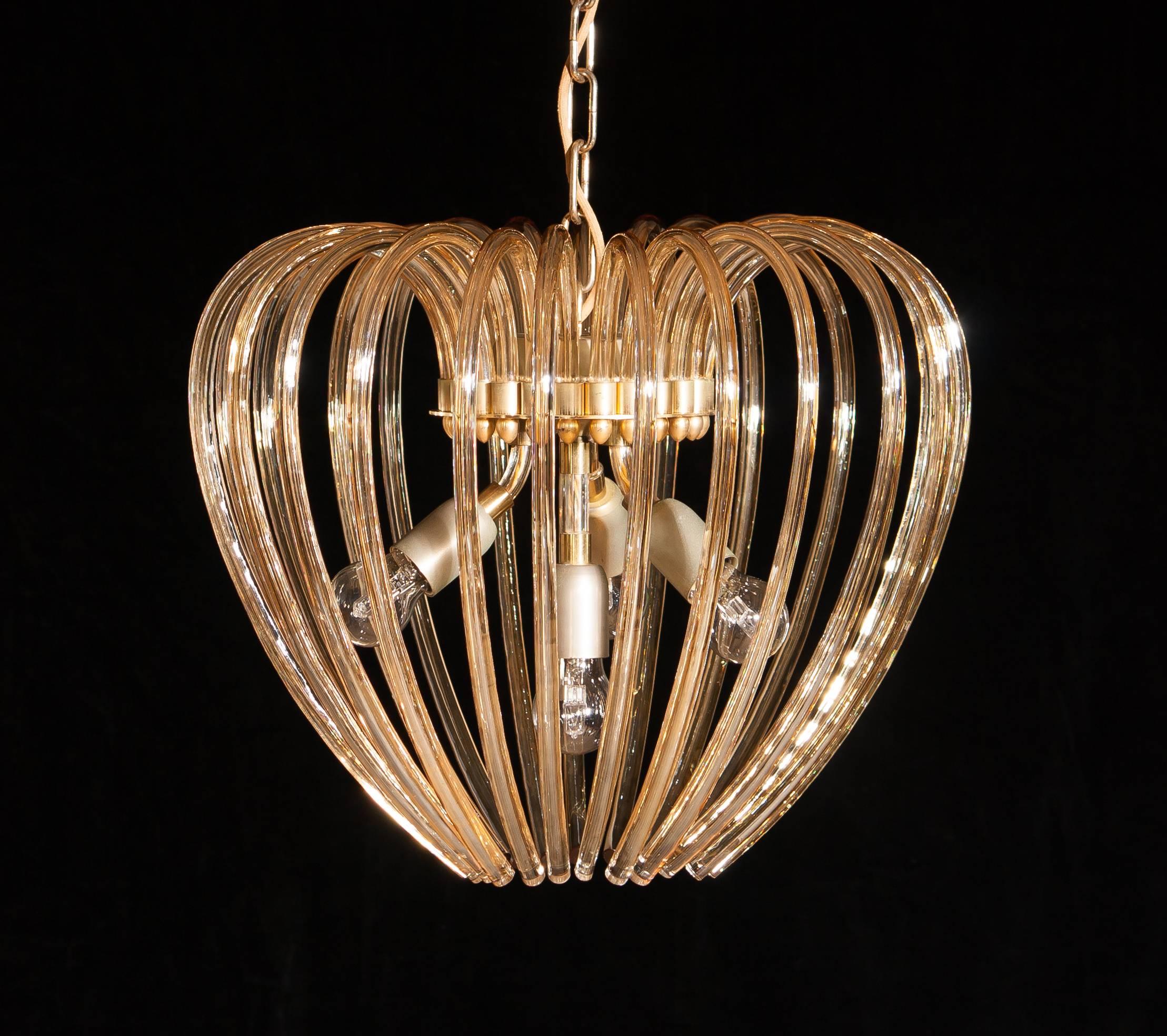 Lovely chandelier by Murano Italy.
This lamp has a beautiful heart shape made of gilded crystal elements.
It is in an excellent condition.
Period 1960s.
Dimension: Total height 90cm, ø.50 cm.