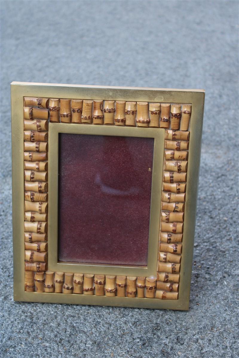 Italy 1970 gilded metal photo frame with natural canes.
Horizontal or vertical position depending on the choice, photo measures 12 x 18 cm.