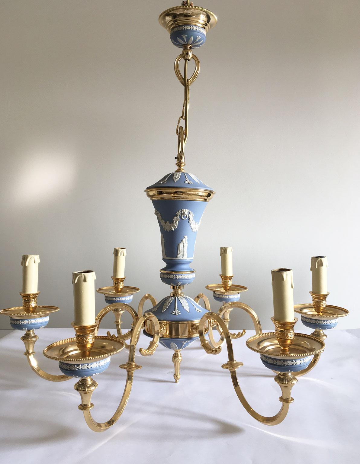 This elegant and glamorous 6 lights Chandelier in sky-blue color, is one of the latest pieces manufactured by a well known Italian factory during the 1970’ and then left in stock until today. The Greek and Roman scenes have been applied by hand and