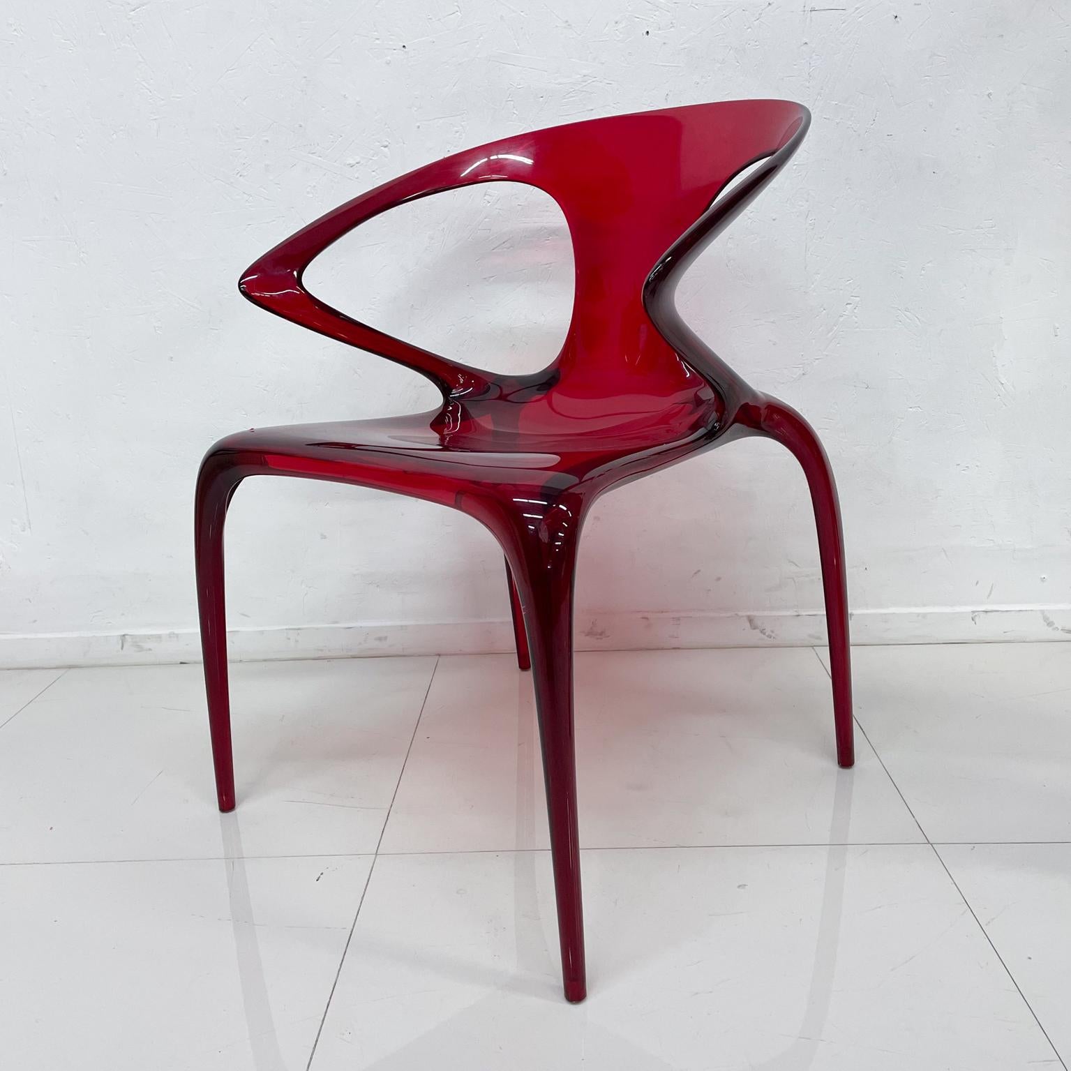 Roche Bobois by designer Song Wen Zhong AVA chair in ruby red plastic lucite.
Made in Italy. Maker stamped. Set of Two chairs.
Italy AVA Bridge Arm Rest Chair designed in Rubis Polycarbonate. 
Eco Light and Stackable with armrests 
Measures: 31 H x