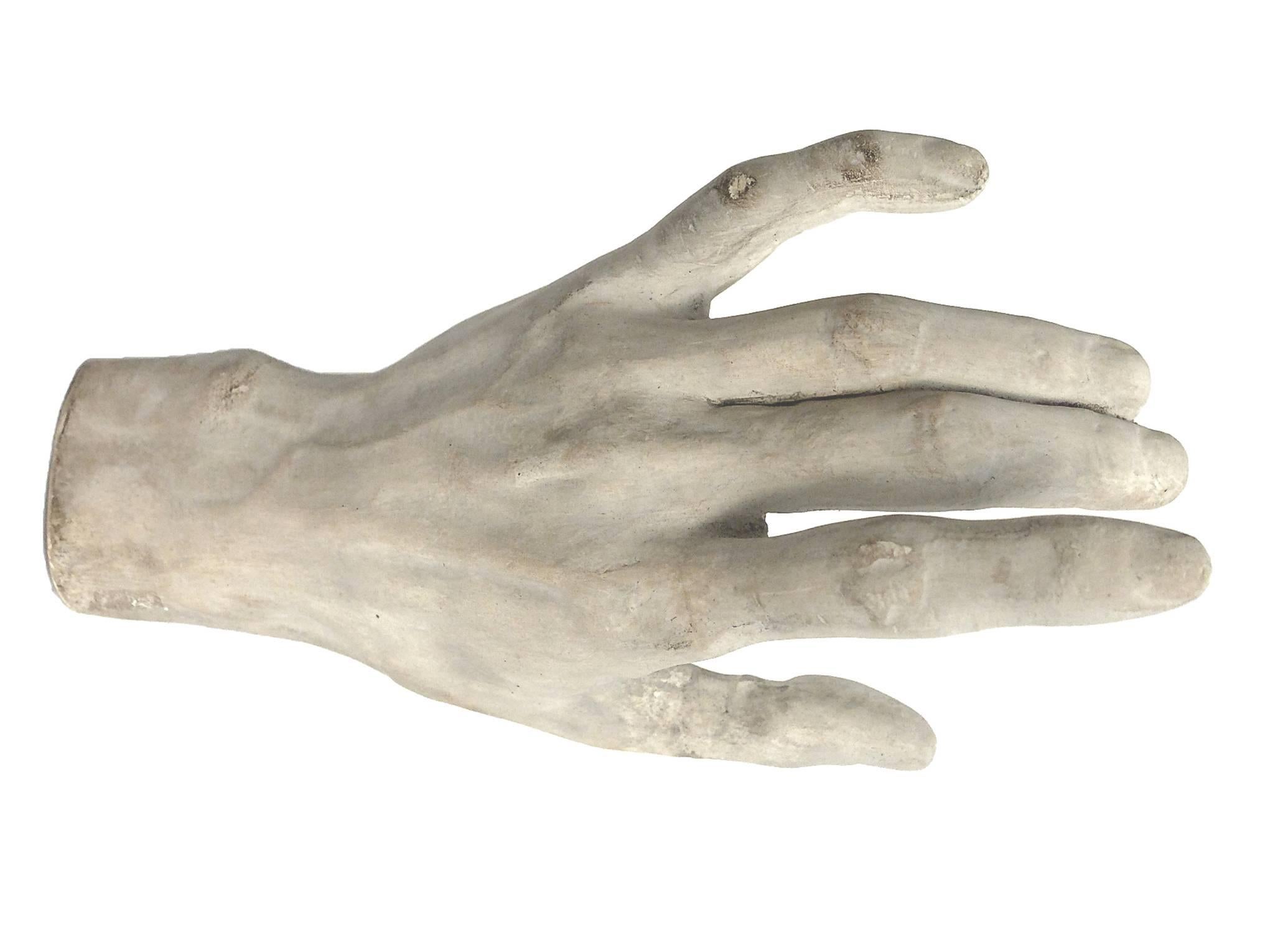A plaster depicting a hand cast for drawing teaching in Academy, Italy, circa 1890.