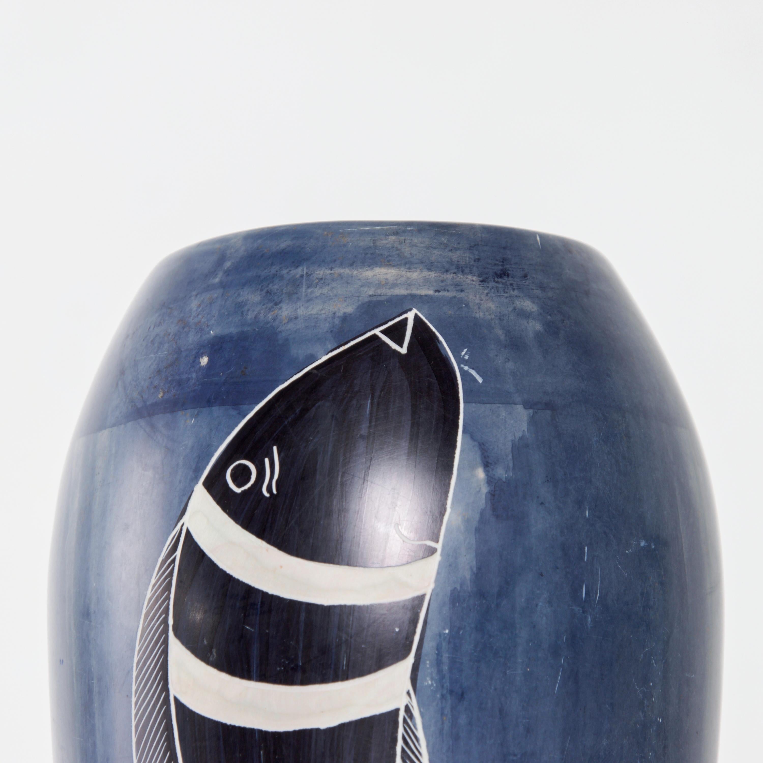 Italy Domina blue wash color fish vase with black and white striped fish of Arts & Crafts style and in the manner of Gio Ponti for Richard Ginori designs.
No signature apparent.
Measures: 10.25 height x 4.13 in diameter
Smooth surface. Sun faded