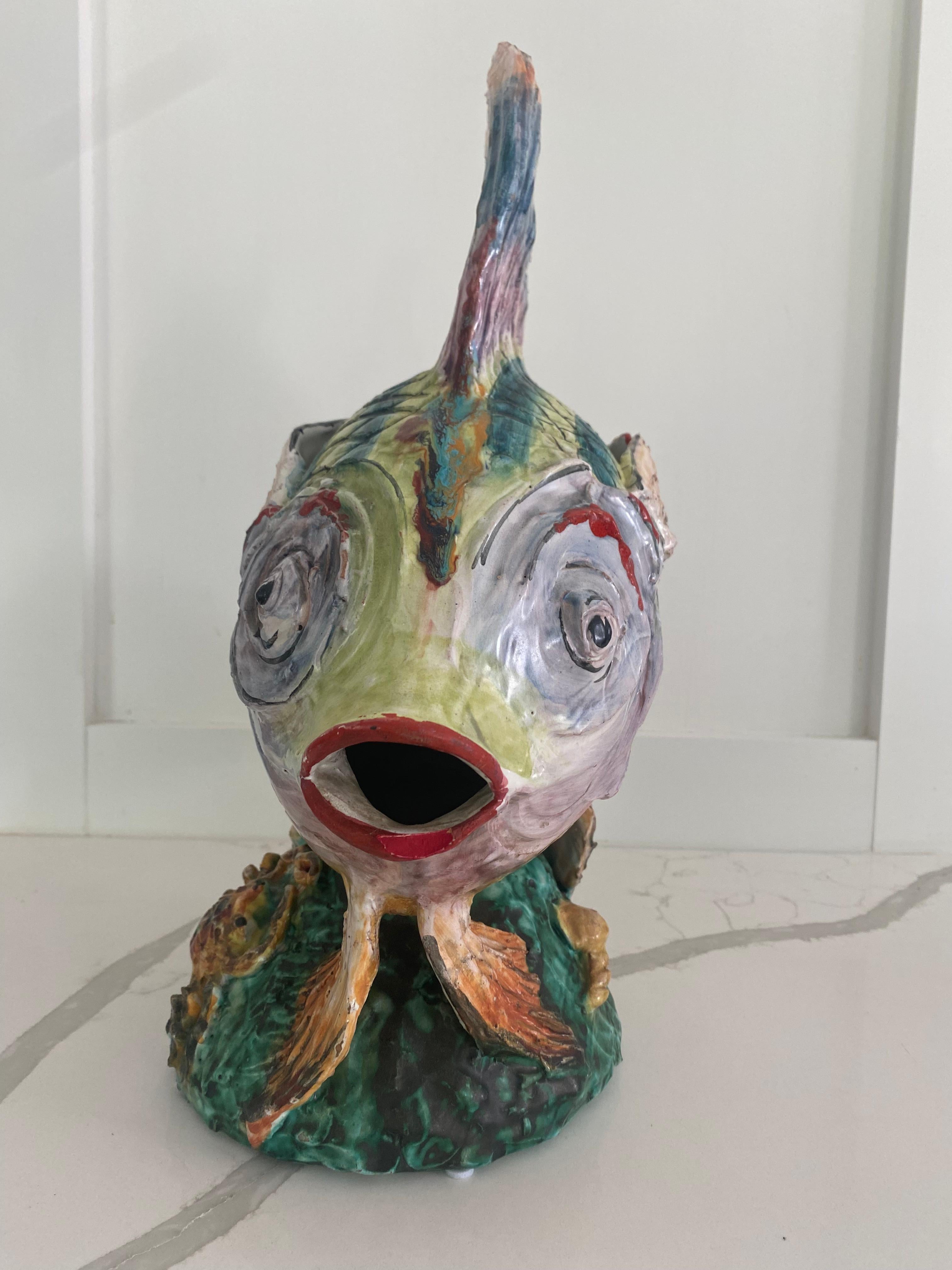 Spectacular modeled fish sculpture with majolica glaze in muilticolors similar to Eugenio Pattarino, Italy.  Detailed base with sea life.

Approx 7 x 17 x 17.5 inches tall