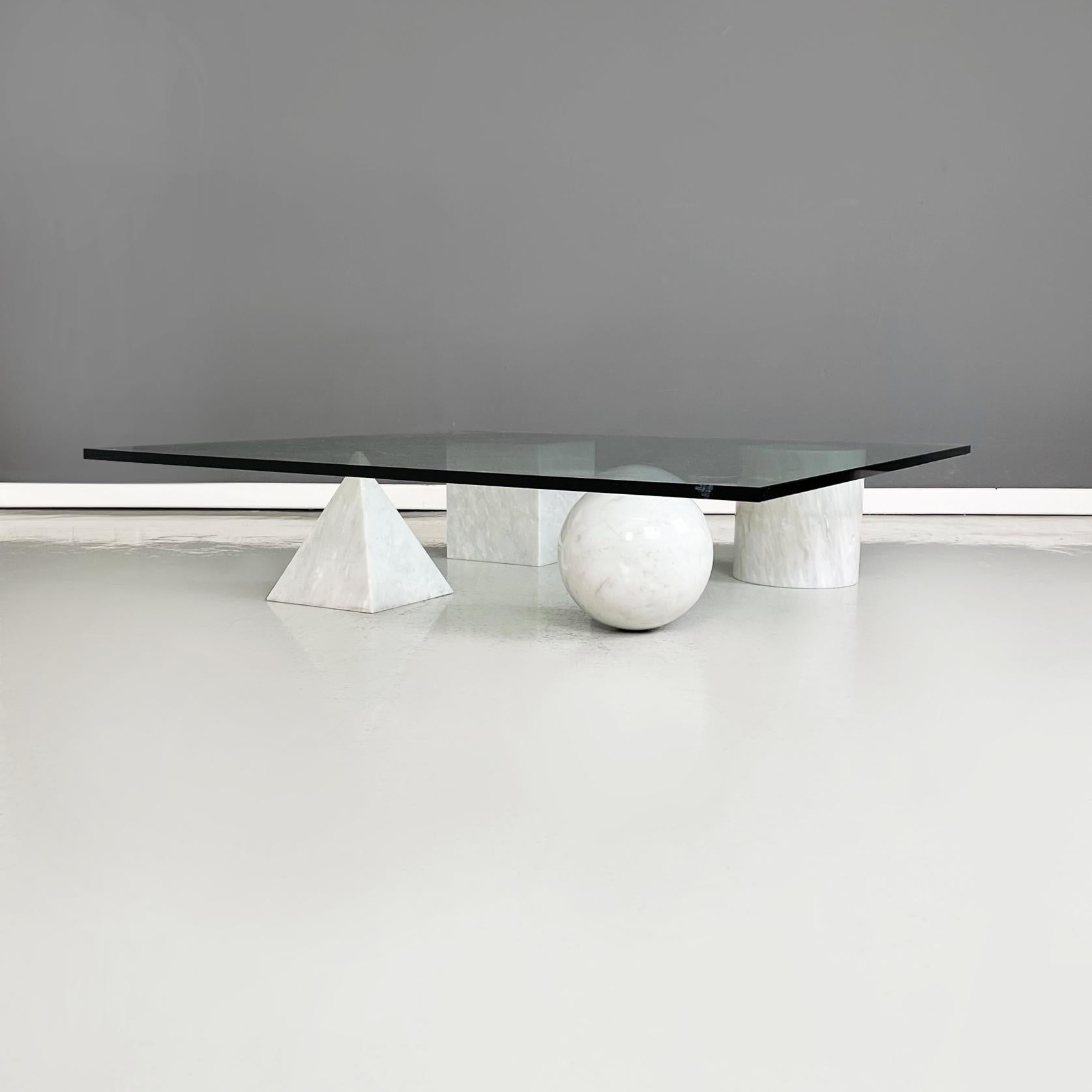 Italy modern Coffe table Metafora by Massimo and Lella Vignelli for Casigliani, 1980s
Coffee table mod. Metafora with square top in thick aquamarine green glass. The 4 legs are made up of 4 geometric shapes in white marble: sphere, cylinder, cube