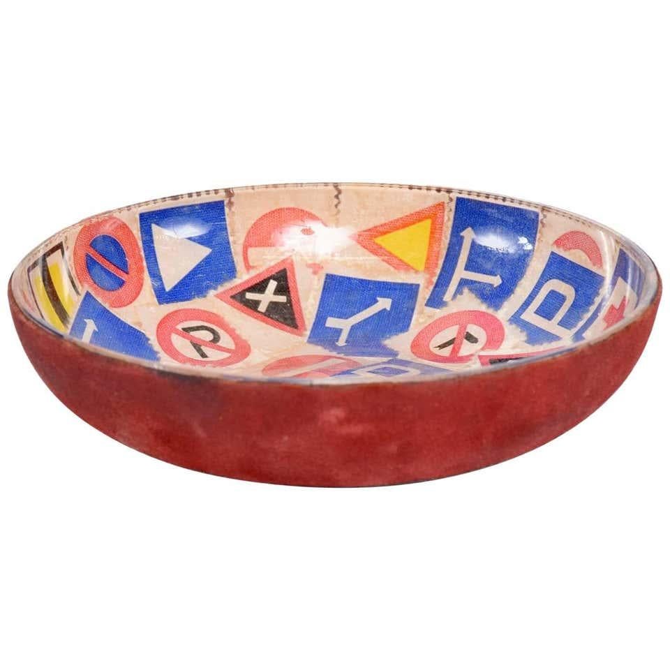 Esso Bowl
Italian Vintage ESSO Motor Oil POP ART Lacquered Copper Bowl Catch-all Bowl Ashtray
Made in Italy.
Metal covered with decorative graphics vintage advertising stamps display road signs and an ESSO Motor Oil Co logo with slogan 'AL VOSTRO