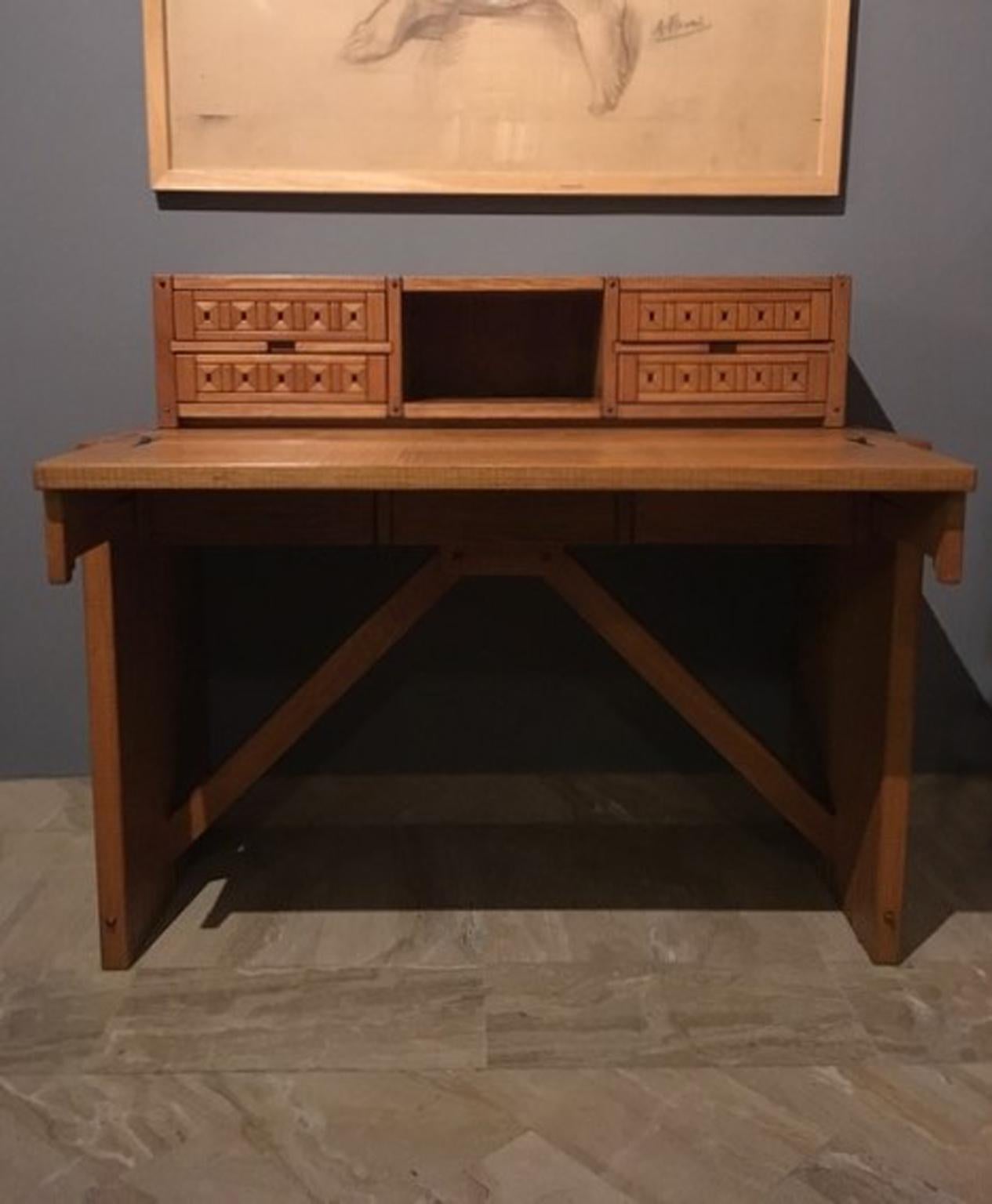 Officina Rivadossi workshop realized in the 1990s this beautiful desk with the typical handwork that characterized all their production and that raised their pieces of furniture to pieces of art. Copy of he original drawing is visible in the