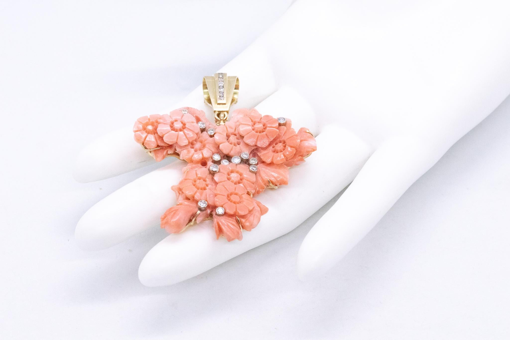 Classic bouquet of flowers pendant with coral

A large piece, created in Naples, Italy at the beginning of the 1970's. The main element is carved from a single piece of natural pink-reddish coral and mounted in a custom crafted setting, made in