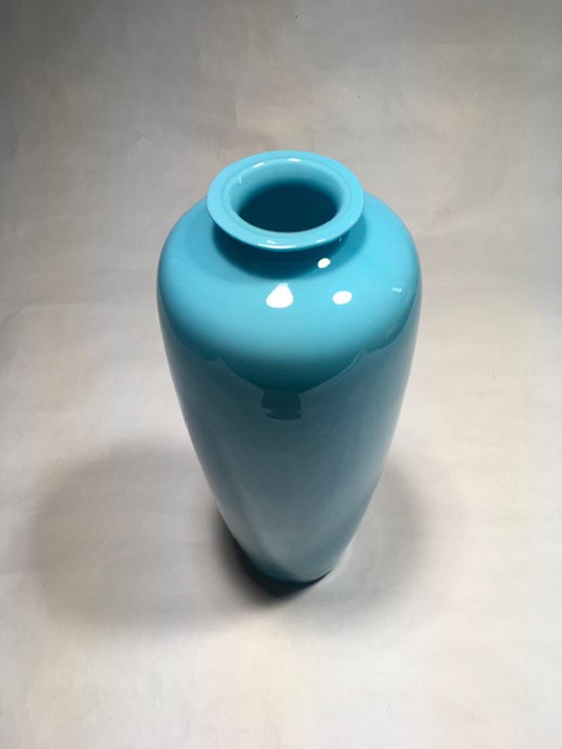 This Post-Modern Murano glass vase has a very elegant and delicate light blue tone.
Becouse it’s not industrial production, the vase shows some little irregularities in the form.