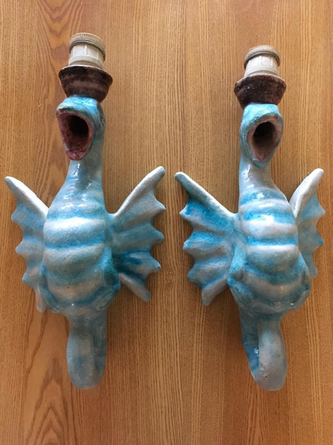 This pair of iconic Italian wall sconces in blue ceramic, are in very good conditions.
The back has some raw parts but they are not visible when wall mounted. The style is following Gabriella Crespi, an iconic Italian interior designer of
