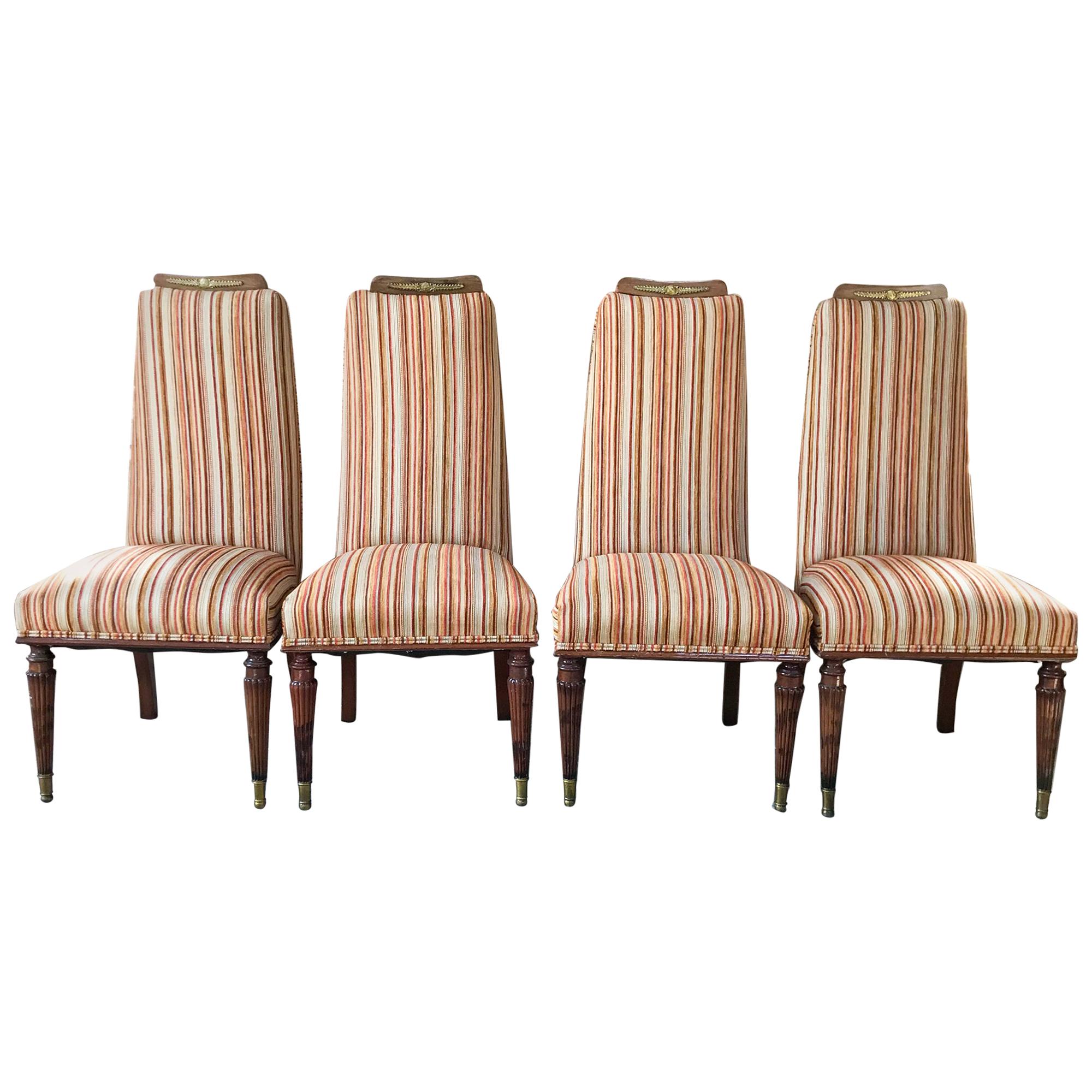 Dining Chairs
Set of 4 Italian Dining Chairs attributed to Vittorio Dassi, Italian Design circa 1950s.
Unmarked.
Warm and Elegant Midcentury Italian Dining Chairs Neoclassical Relief Ornamentation with sculptural brass capped legs. 
Lovely rich wood