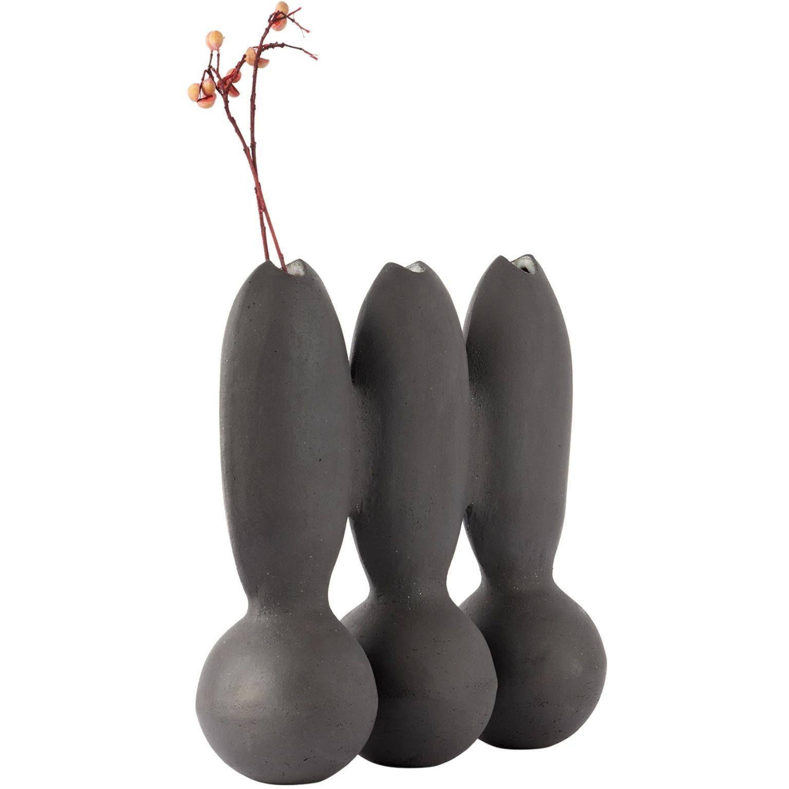 Itera Black Triple Vase by Ia Kutateladze
One Of  A Kind.
Dimensions: D 10 x W 30 x H 27 cm.
Materials: Raw black clay.

Handcrafted sculptural ceramic vase in black. Three openings at the top. Please note coloration may vary. Each piece is one of a