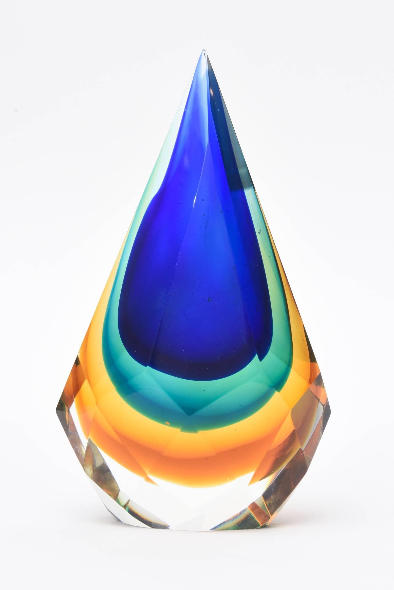 This stunning teardrop shaped Italian Murano diamond faceted Sommerso glass sculpture/ paperweight/ desk accessory is most unusual. The layers of brilliant colors are cobalt blue, emerald green, amber to yellow to clear. The diamond faceted forms