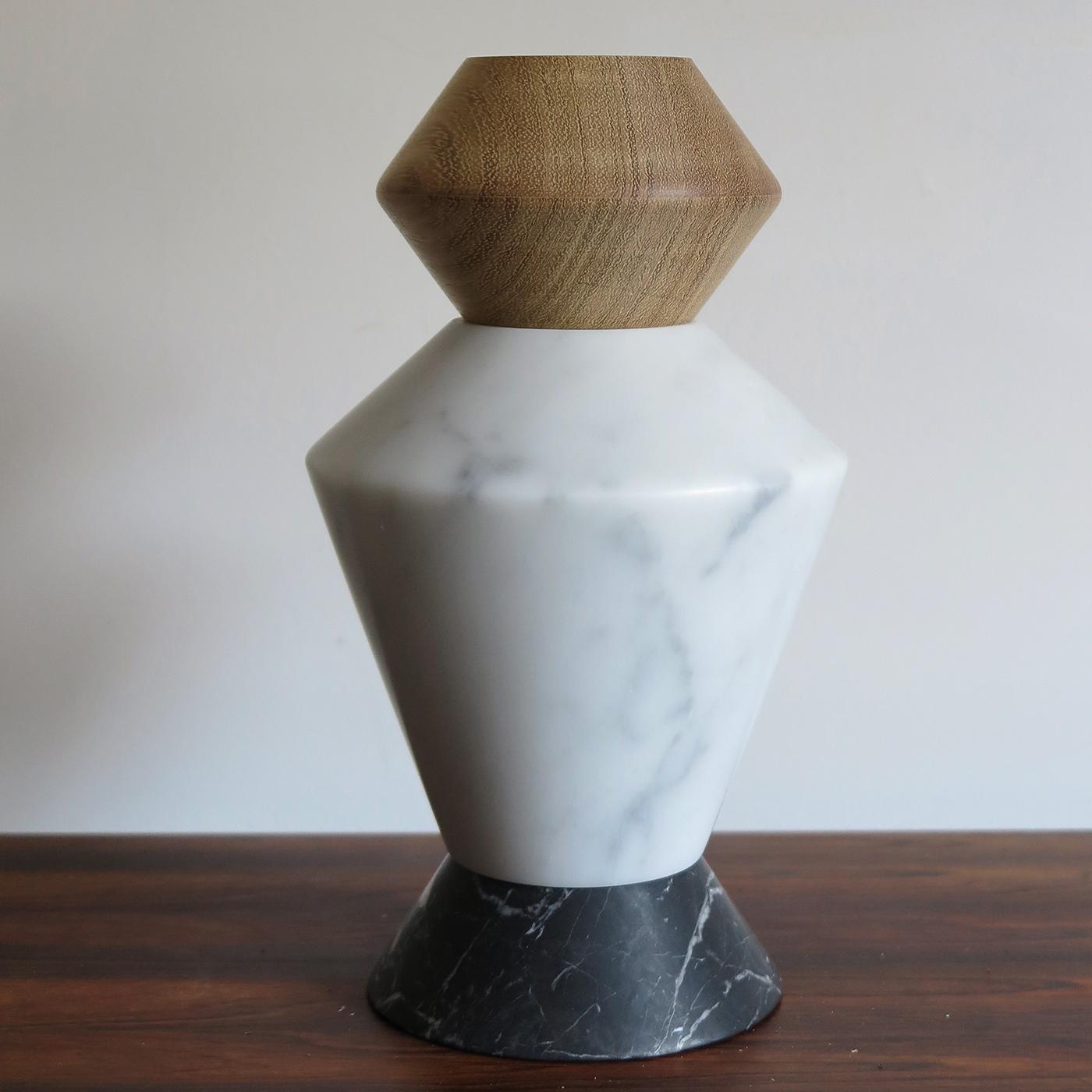 An example of exquisite traditional craftsmanship that relies on pure, authentic materials, this iTotem is a sculptural work of art that functions as a vase or candle holder. Arranged in a unique, variable composition, it features four geometric