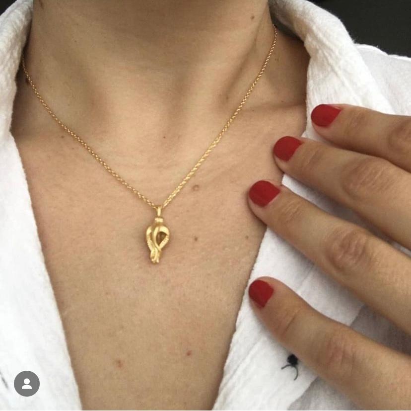 This delicate, tiny baby octopus is the perfect light-weight necklace to wear every day or as a focal point for a formal affair. Cast in 18 karat yellow gold and string on a 16