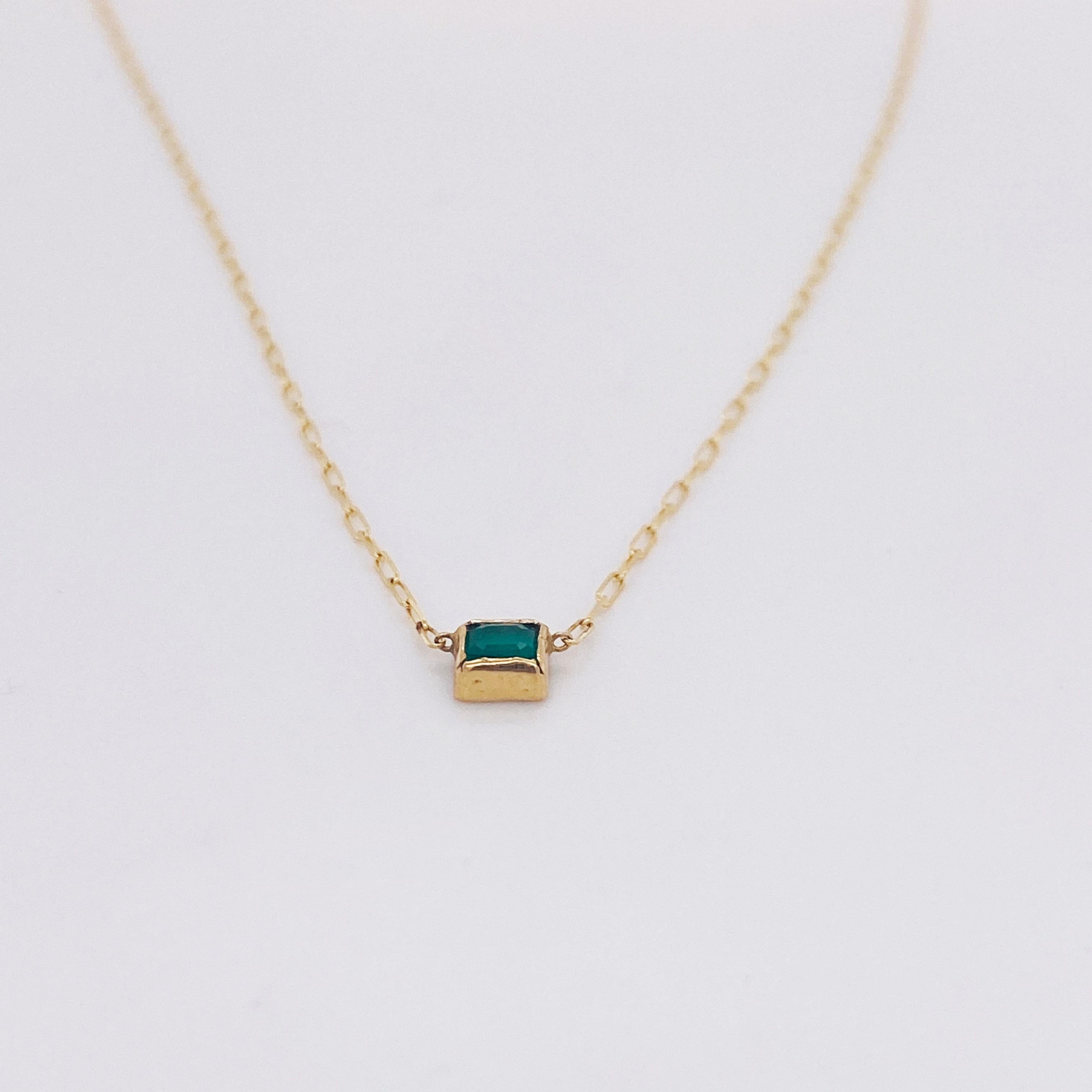 An emerald is a very valuable gemstone and it is very appealing to the eye. This necklace couples the perfect green color with this gorgeous exquisite 14-karat yellow, 1-millimeter paper clip chain! It is 16.5 inches long. Emerald also looks great