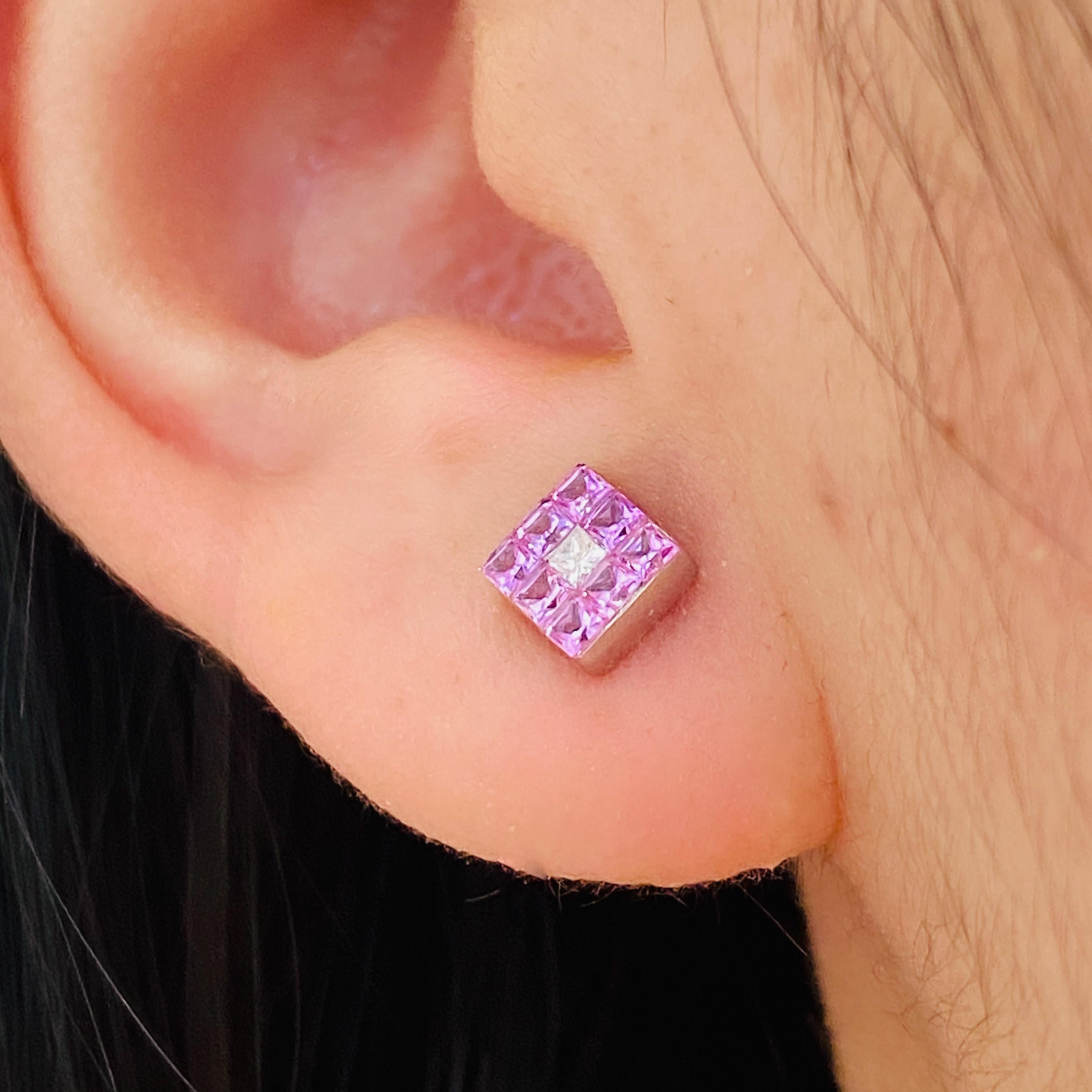 Pink sapphires shine brightly in these adorable little studs accented by a sparkling diamond at their center. Pink is the color most often associated with charm, politeness, sensitivity, tenderness, sweetness, childhood, femininity and the romantic.